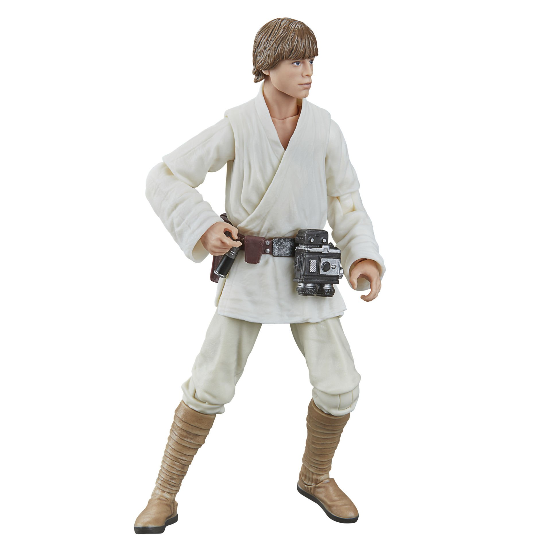 Beyaz elbiseler ve kahverengi botlarla bir Luke Skywalker aksiyon figürü, siyah bir cihaz ve cihazlı bir kemer tutuyor.