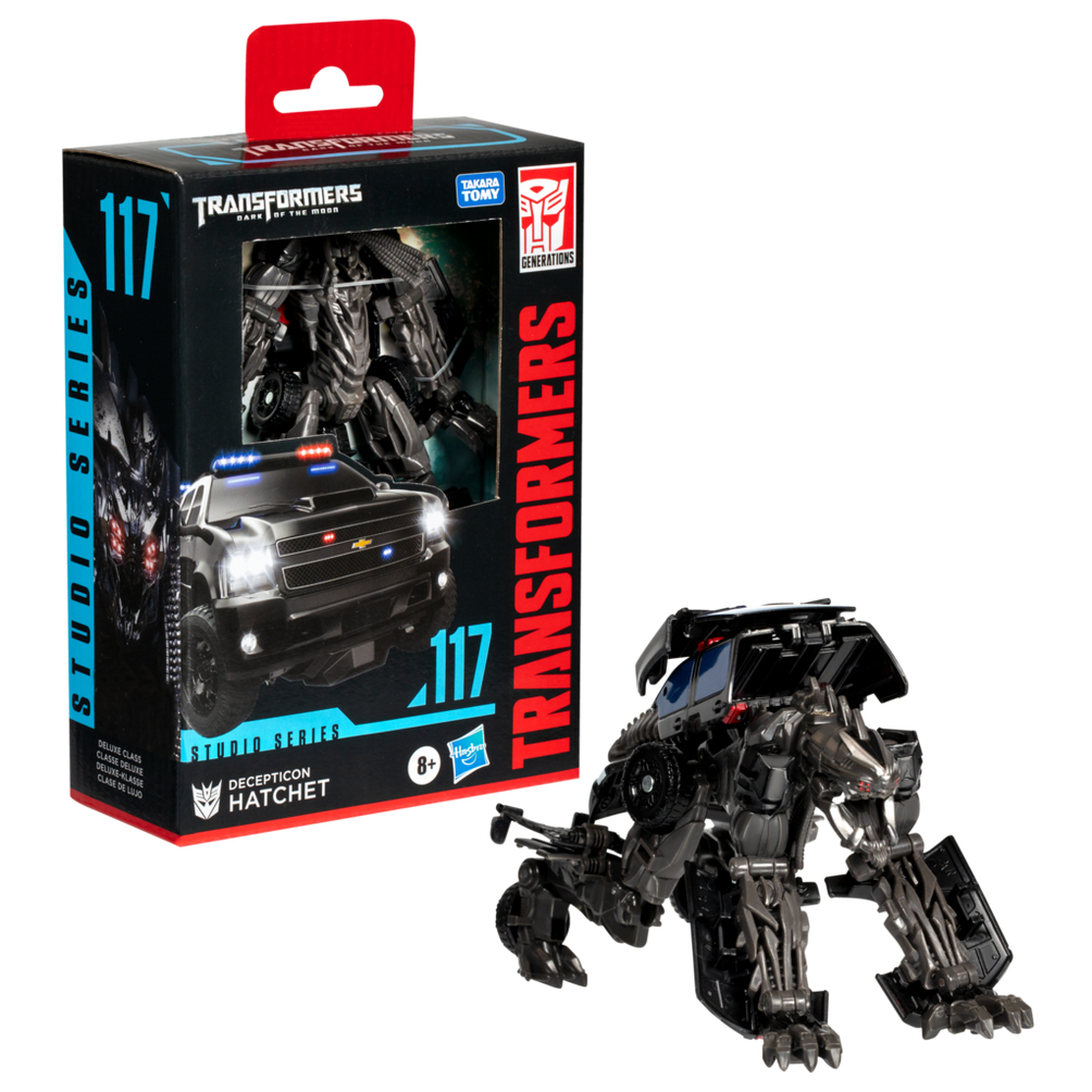 Bir Transformers oyuncağı, Hatchet, robot şeklinde, kutusunun yanında. Kutu, araba şeklini gösteriyor. Her ikisi de siyah ve gri.