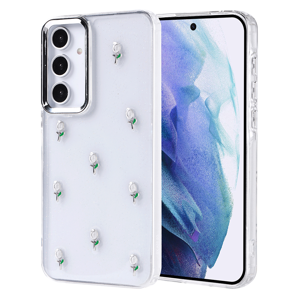 Küçük, gümüş çiçek desenli şeffaf bir telefon kılıfı. Telefon, mavi ve beyaz bir tasarım gösteren bir ekranı olan bir Samsung Galaxy'dir.