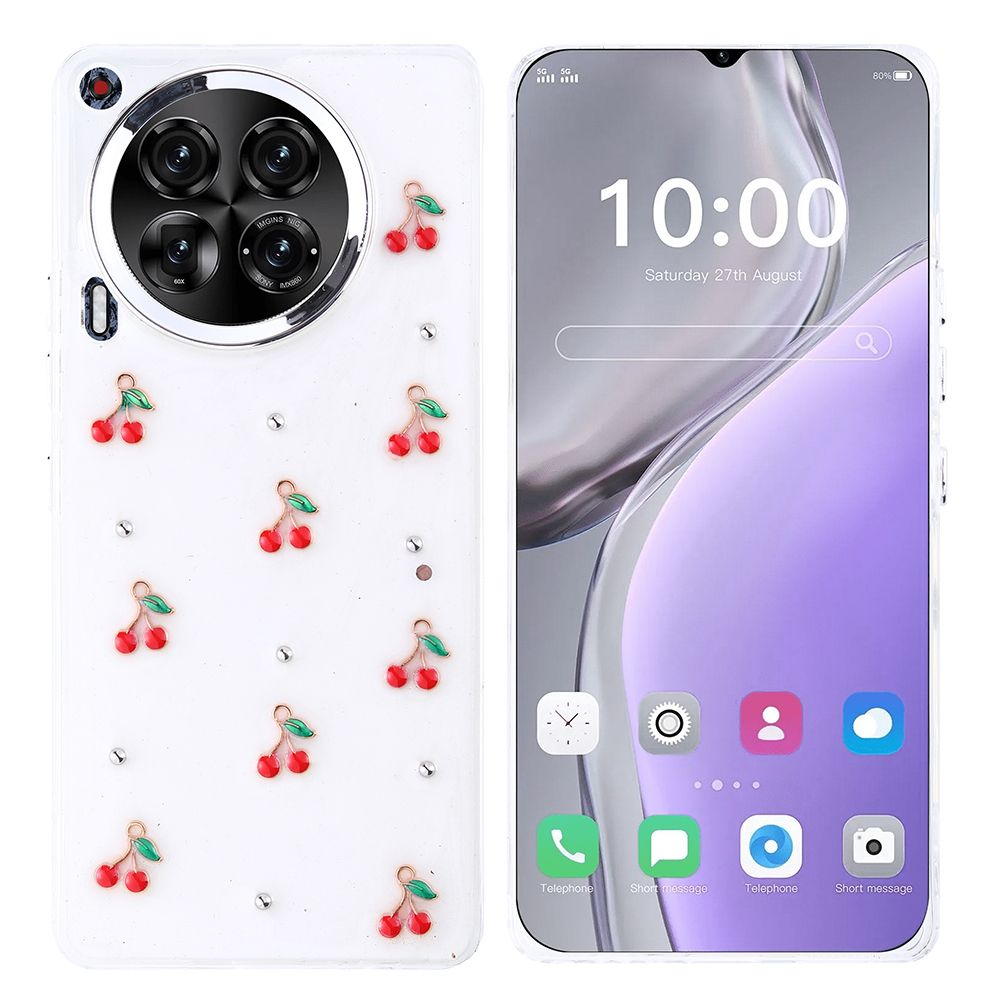 Beyaz kasalı, kiraz ve yapay elmaslarla süslenmiş, ekranda saat 10:00 ve simgeleri gösteren bir telefon.