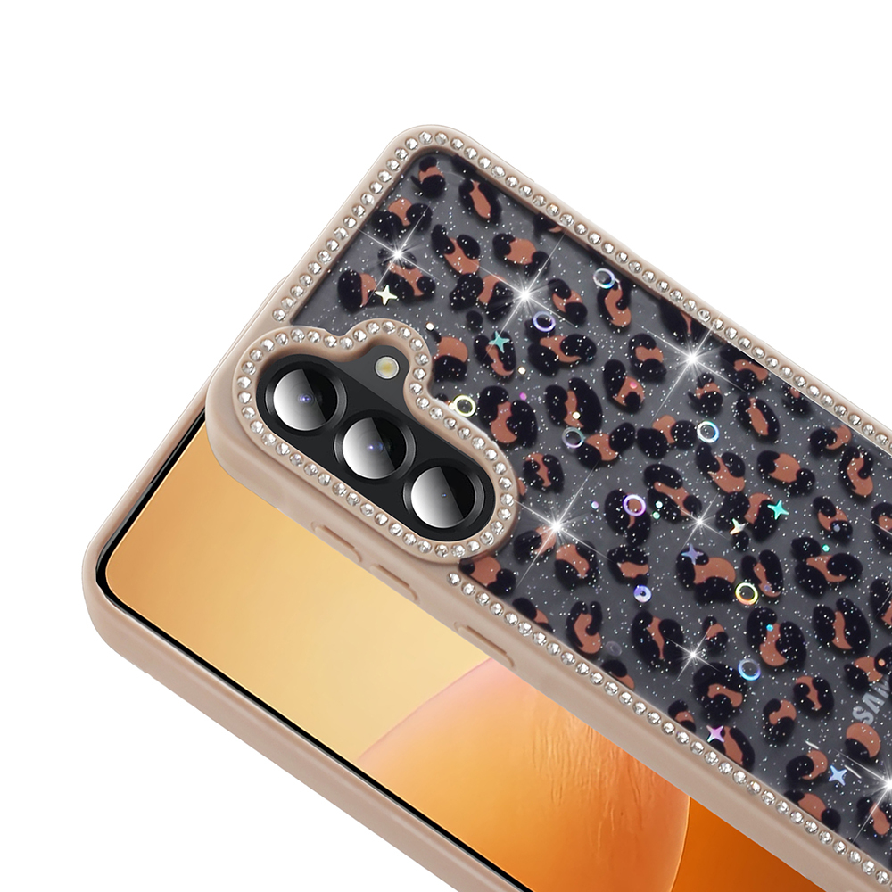 Leopar desenli ve mücevher detaylı bir telefon kılıfı. Ekran, turuncu bir geçiş gösteriyor.