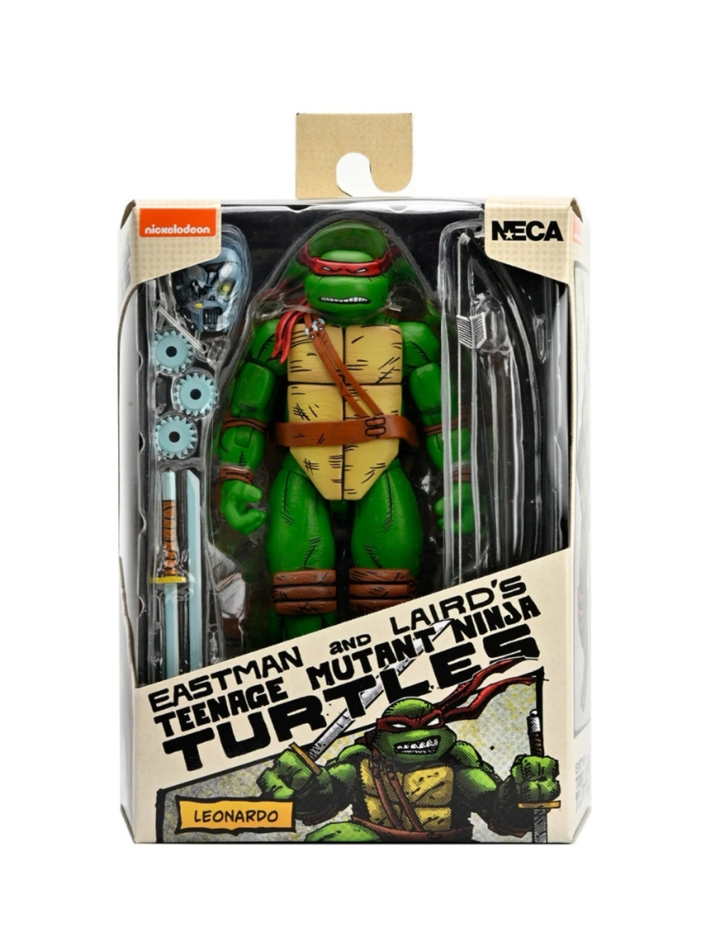 Kutu içinde Teenage Mutant Ninja Turtles aksiyon figürü. Kırmızı maskeli, kahverengi askılı ve aksesuarlı yeşil figür.