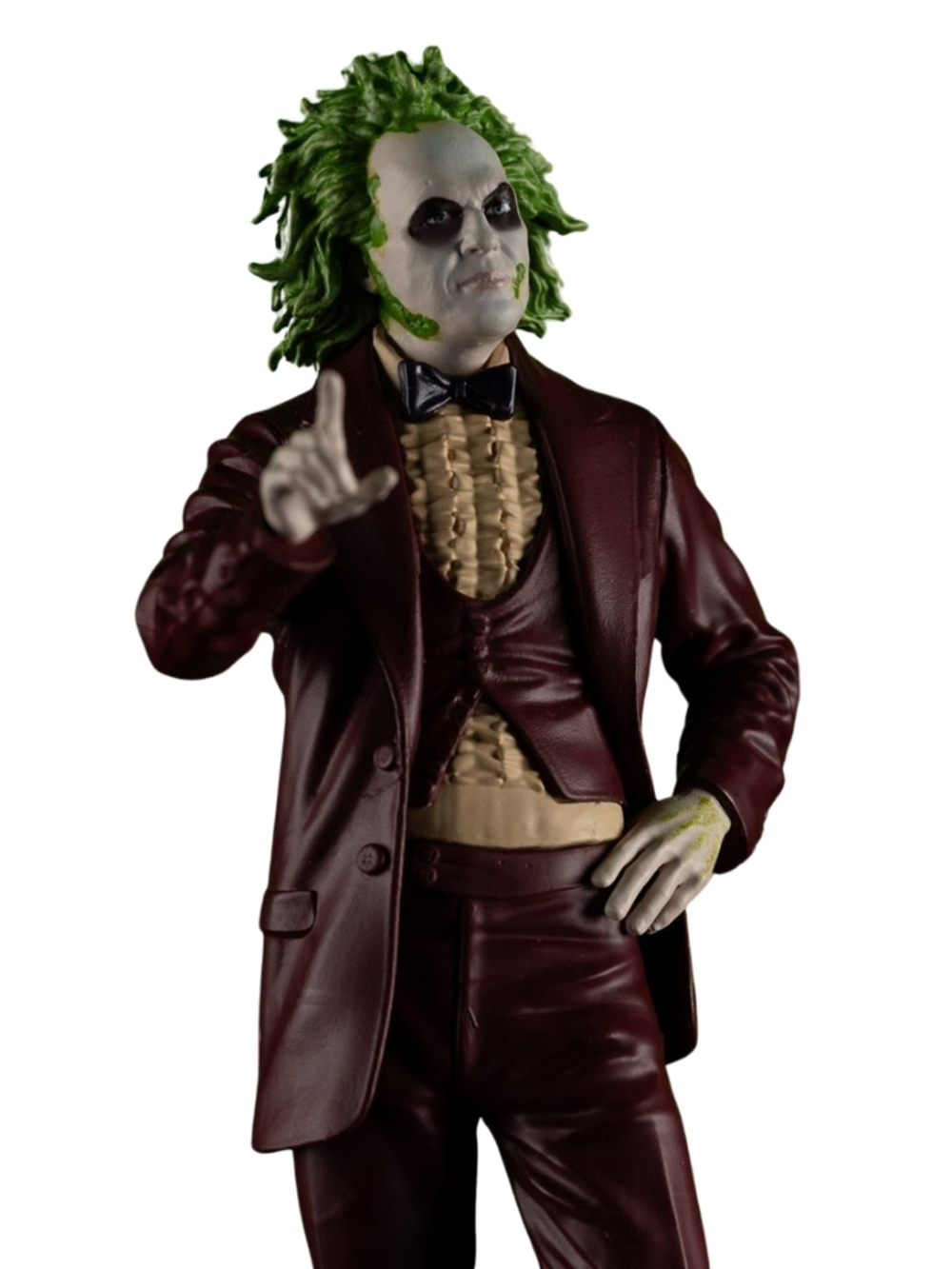 Burgonya takım elbiseli, yeşil saçlı, işaret eden bir Beetlejuice figürü. Soluk tenli ve papyonlu, bir eli kalçasında.