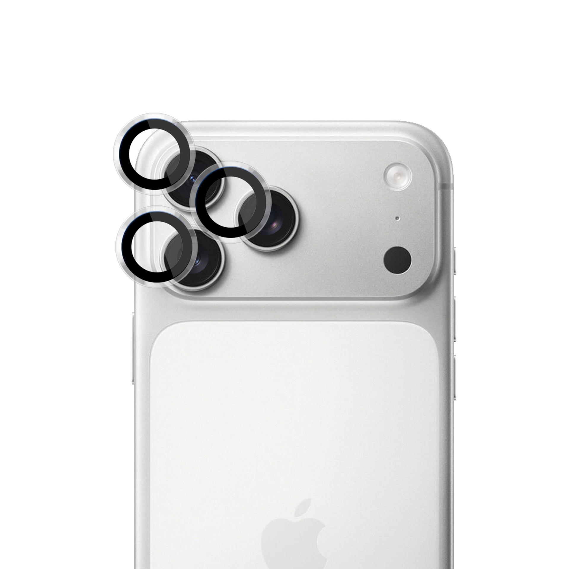 Tył smartfona z osłonami obiektywu. Srebrny telefon z czterema osłonami obiektywu i dwoma innymi elementami aparatu.