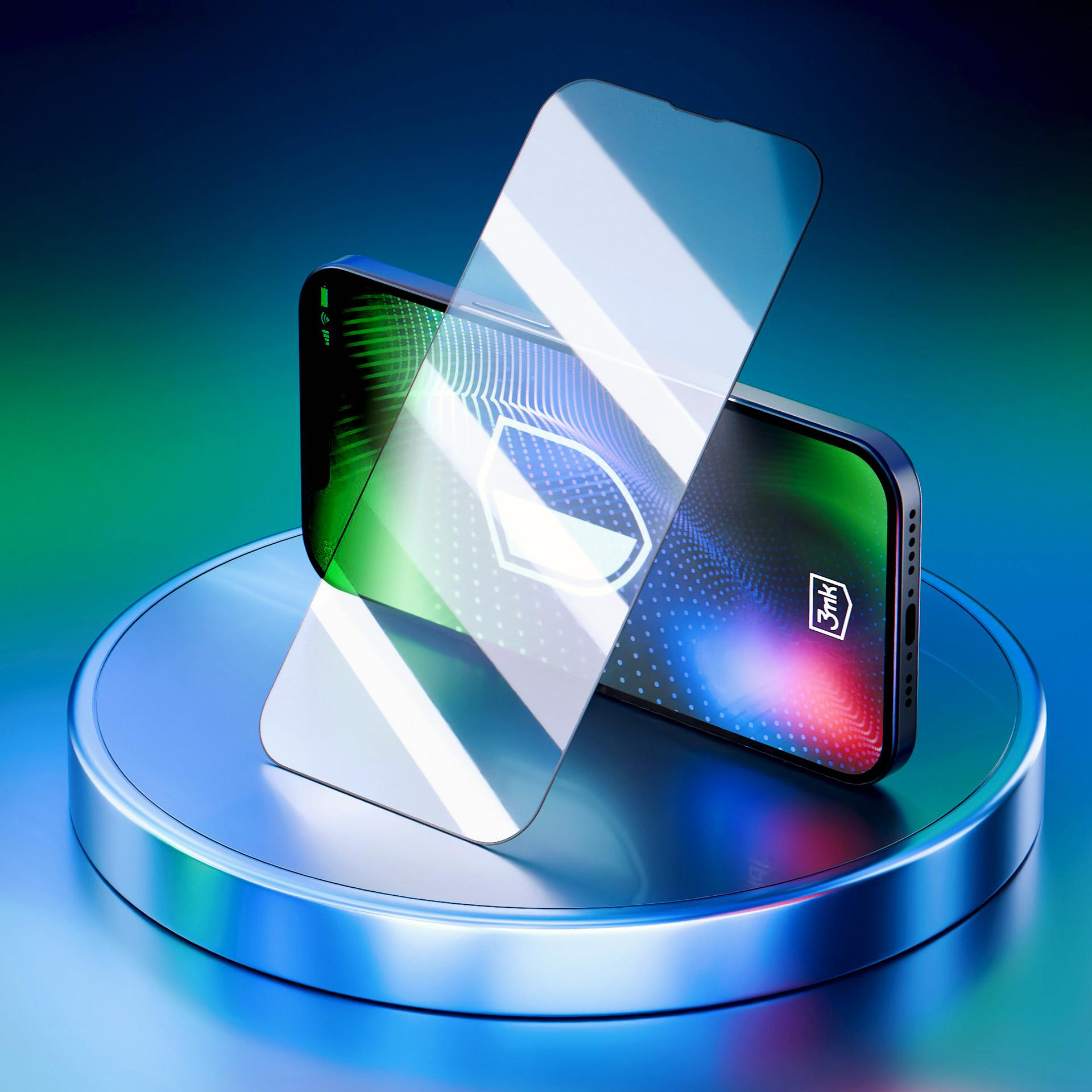 Smartfon z ochraniaczem ekranu na metalowej podstawce. Ekran wyświetla wzór. Tło jest niebieskie.