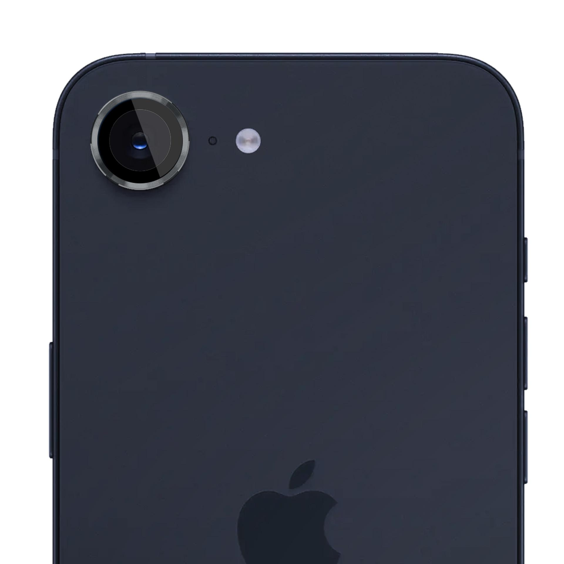 Tył ciemnoniebieskiego smartfona z obiektywem aparatu i lampą błyskową. Widoczne logo Apple.