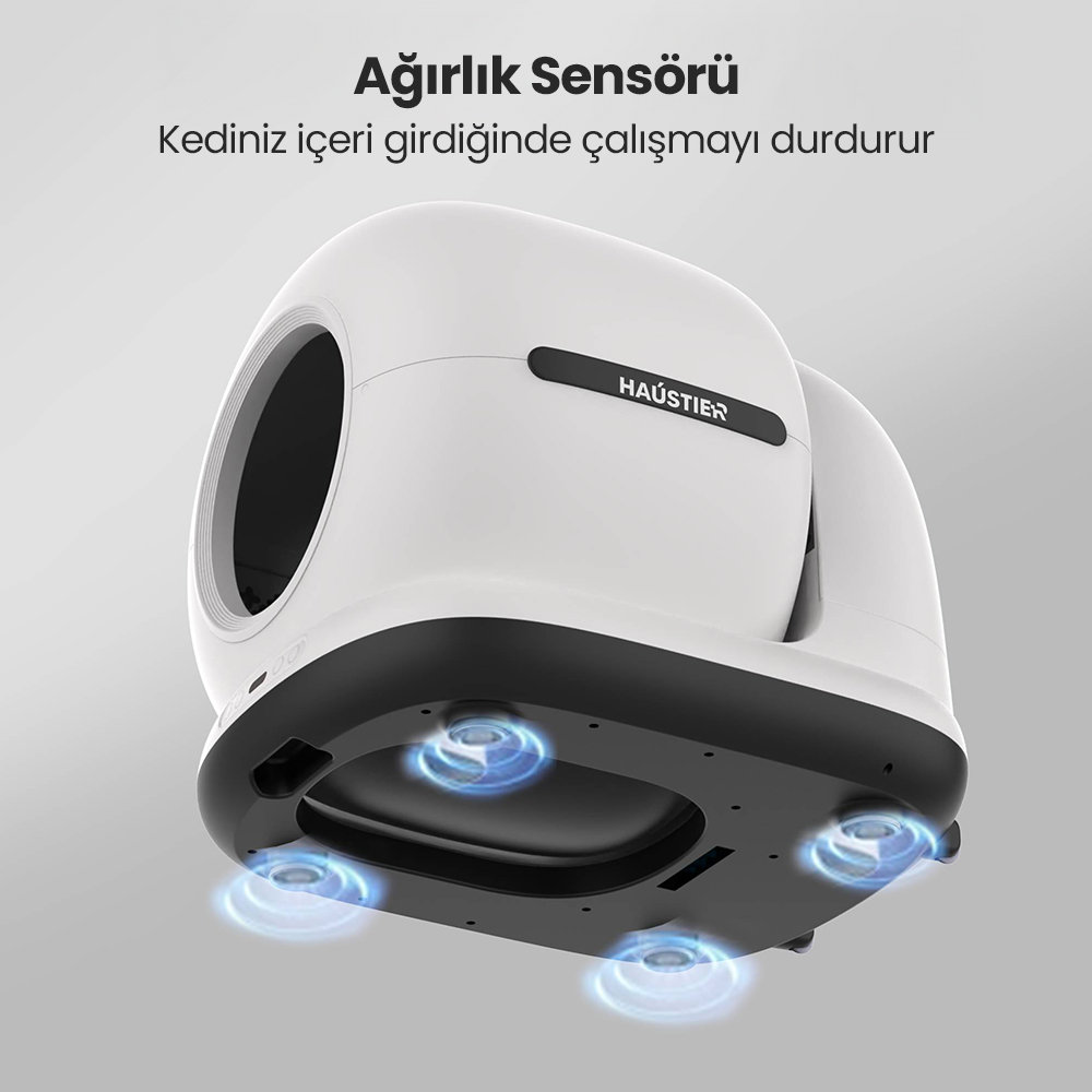 Altında mavi parlayan daireler bulunan beyaz ve siyah bir kedi kumu kabı. Türkçe metin: Ağırlık sensörü.