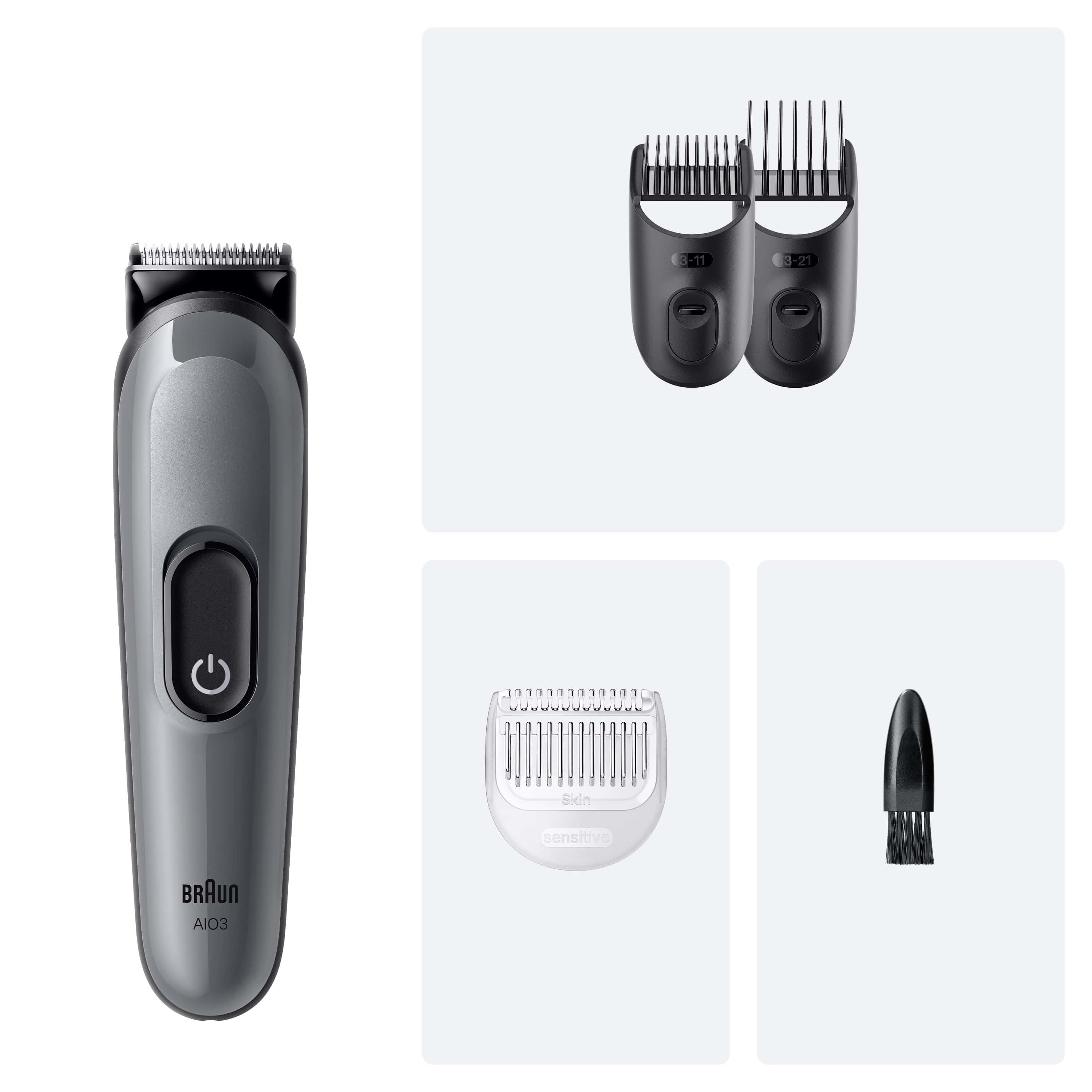 Un regolabarba Braun AI3 con accessori: due pettini, una testina per pelli sensibili e una spazzola di pulizia.