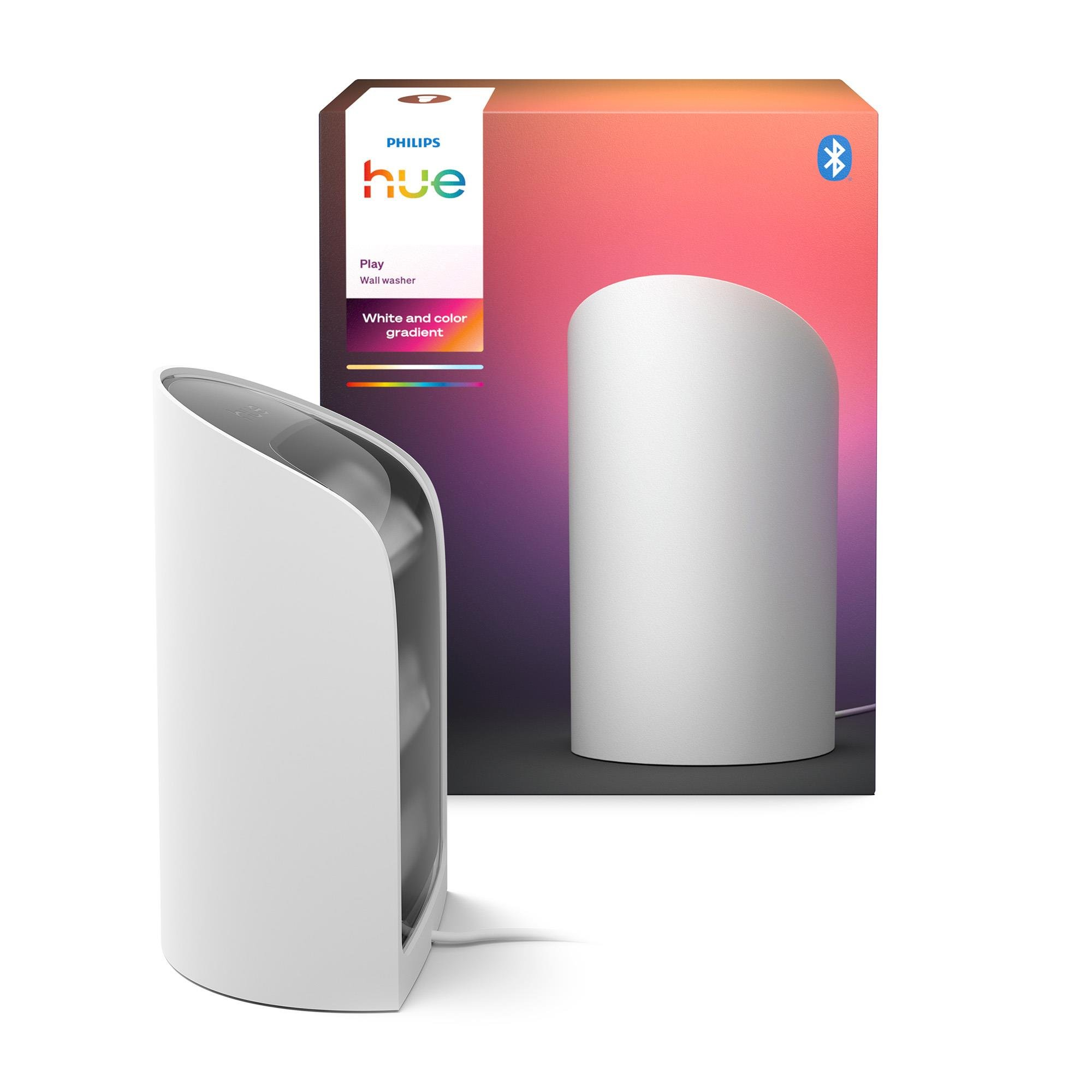 Una luce bianca Philips Hue Play e la sua confezione. La confezione è rosa e bianca con un logo.