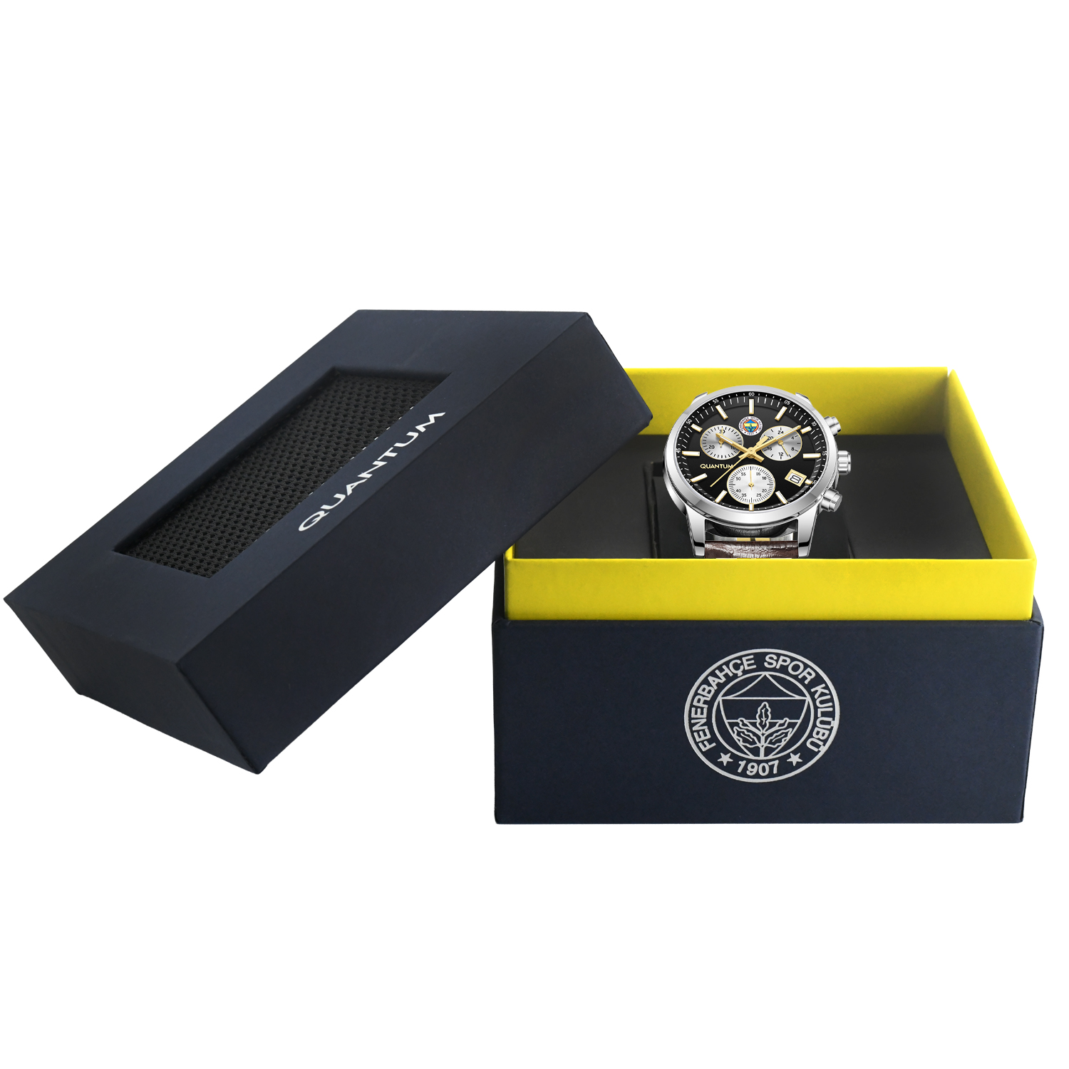 Bir kutuda saat. Saat gümüş renkli, siyah kadranlı, kutu ise Fenerbahçe logosu ile lacivert ve sarıdır.
