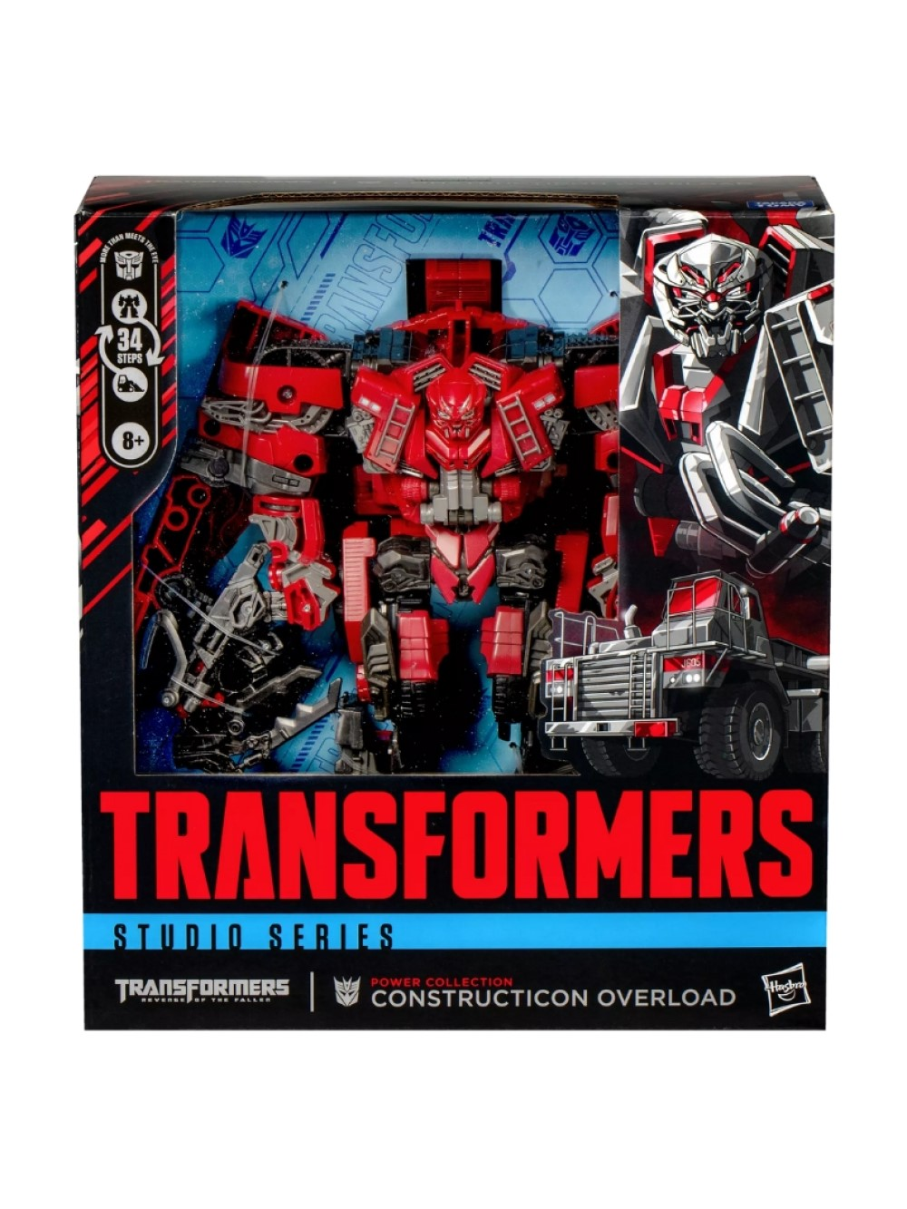 Kutulu bir Transformers Studio Series Constructicon Overload figürü. Kırmızı ve gri, kamyon detaylarına sahip. Kutuda robot sanatı yer alıyor.