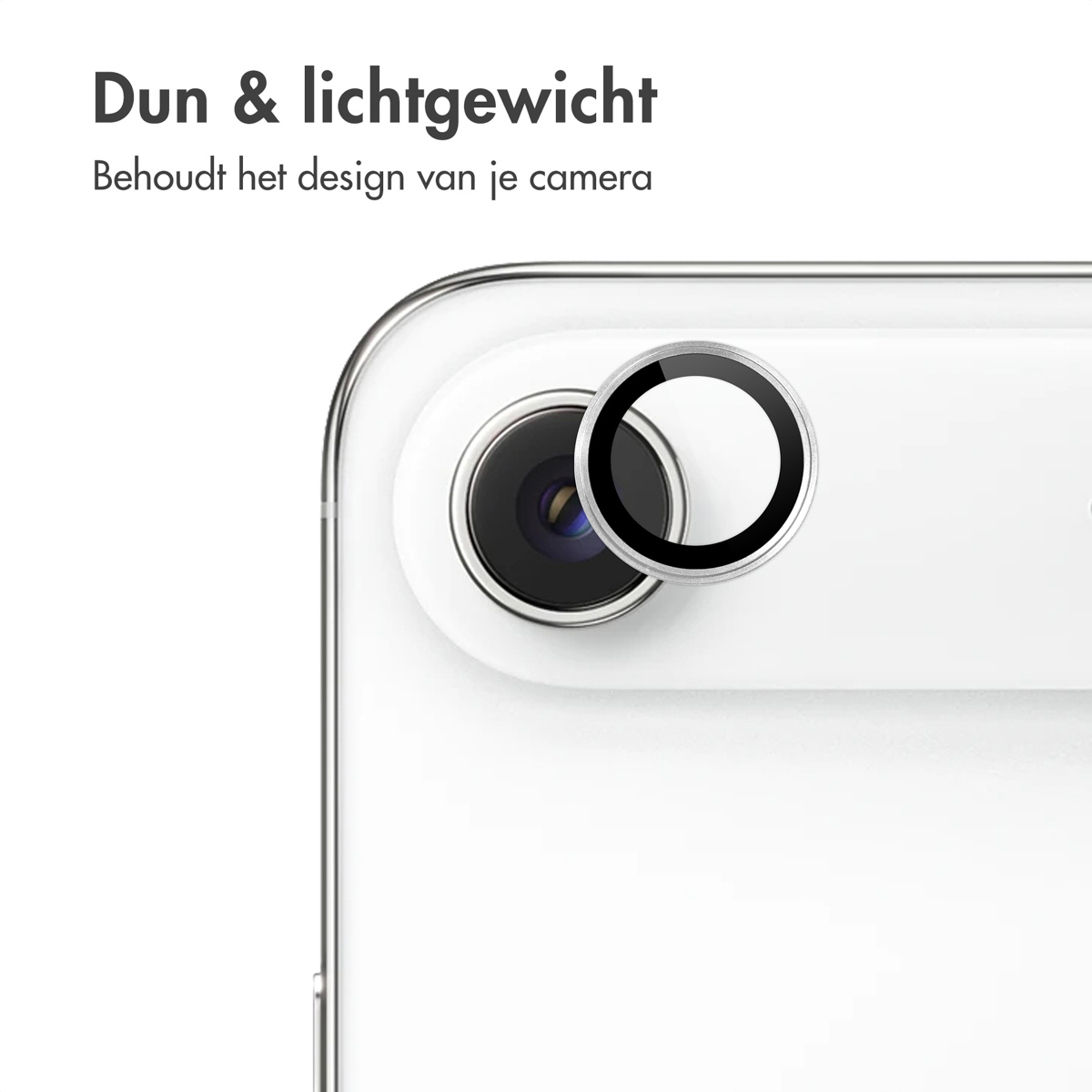 Close-up of a phone camera lens with a protective ring. The phone is white, and the ring is silver and black.