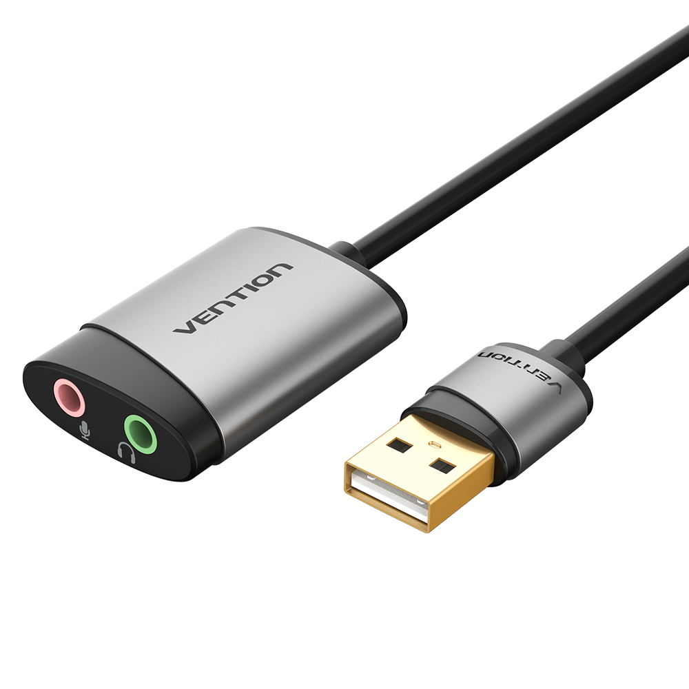 Adapter audio USB Vention. Posiada srebrno-czarną obudowę z różowymi i zielonymi gniazdami audio. Złącze USB na końcu.