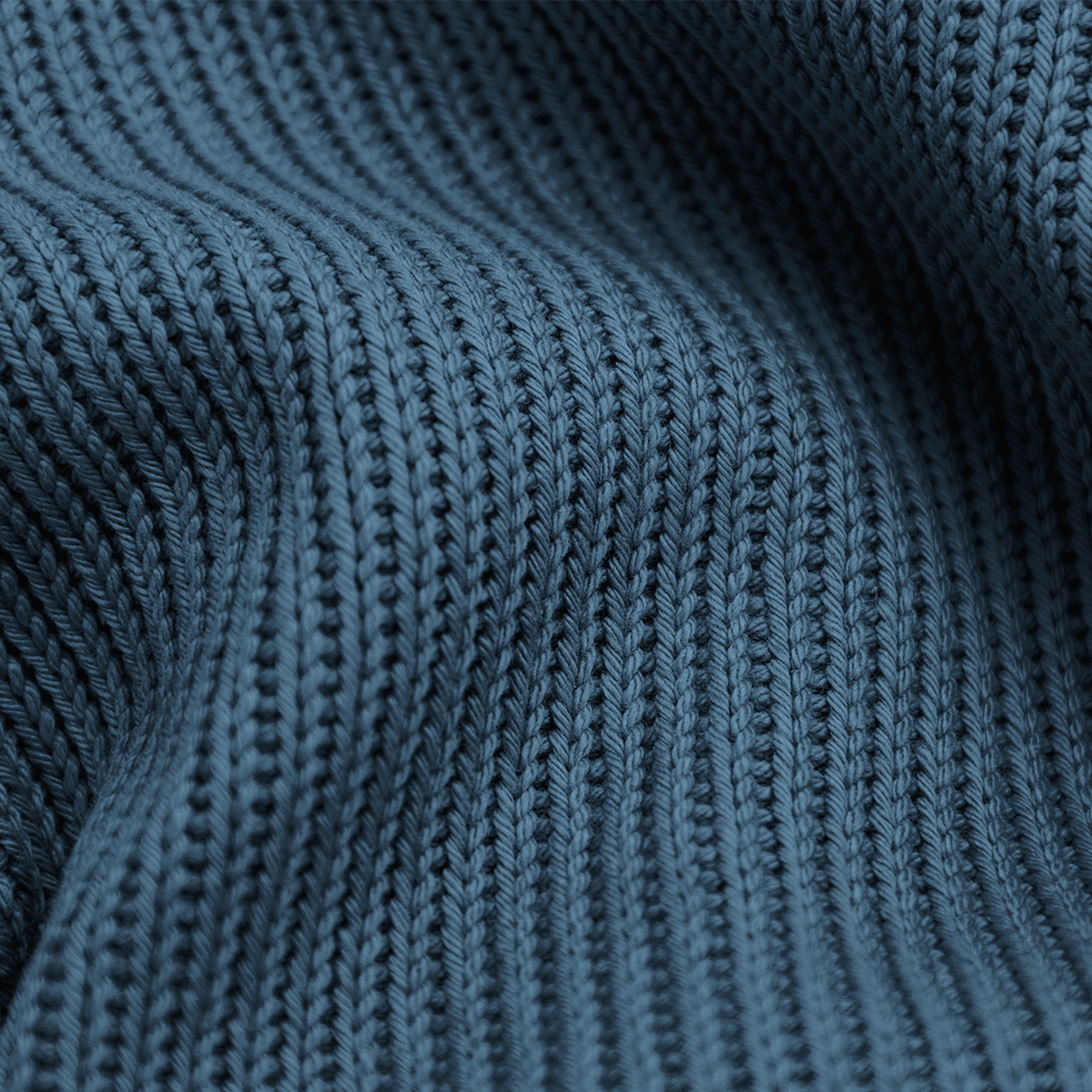 Close-up van getextureerde, blauwgroene gebreide stof. De stof heeft zichtbare ribbels met een lichte golf.