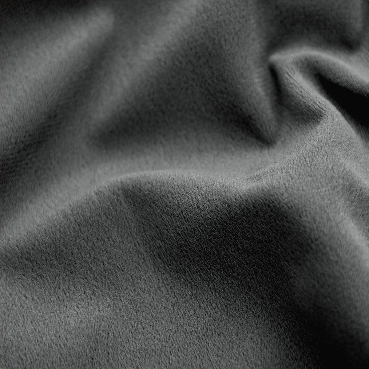Close-up of soft, grey fabric with folds and texture. The surface appears plush and velvety, with varying shades of grey.
