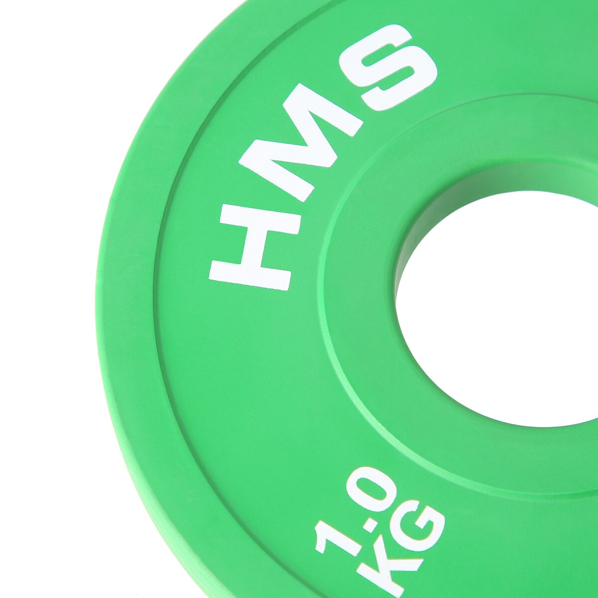 Grüne Hantelscheibe mit weißem Text: HMS, 1,0 KG. Kreisförmige Form mit zentralem Loch. Isoliert auf weißem Hintergrund.