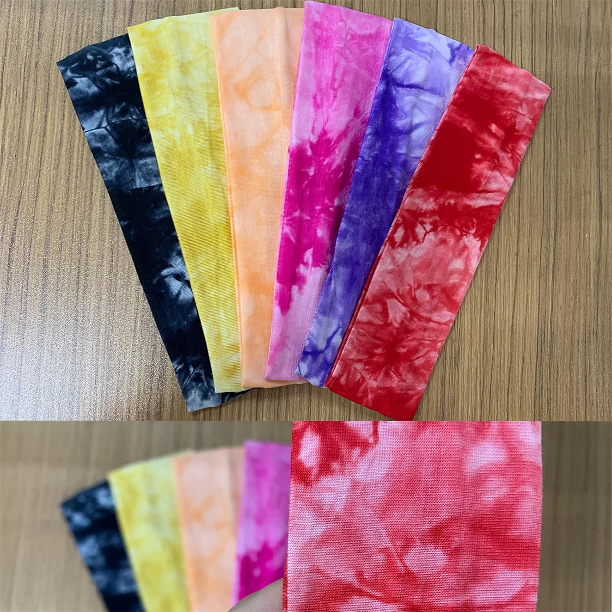 Sieben Stirnbänder im Batik-Stil in verschiedenen Farben: Schwarz, Gelb, Orange, Rosa, Lila und Rot, auf einer Holzoberfläche angeordnet.