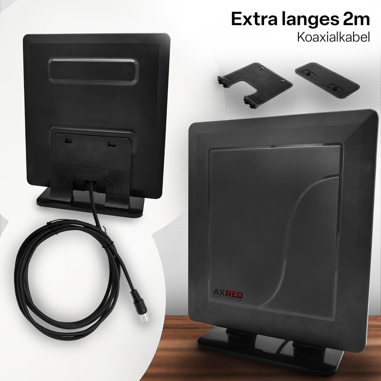 Eine schwarze Antenne mit Kabel und zwei kleinen schwarzen Teilen. Der Text lautet oben 'Extra langes 2m Koaxialkabel'.