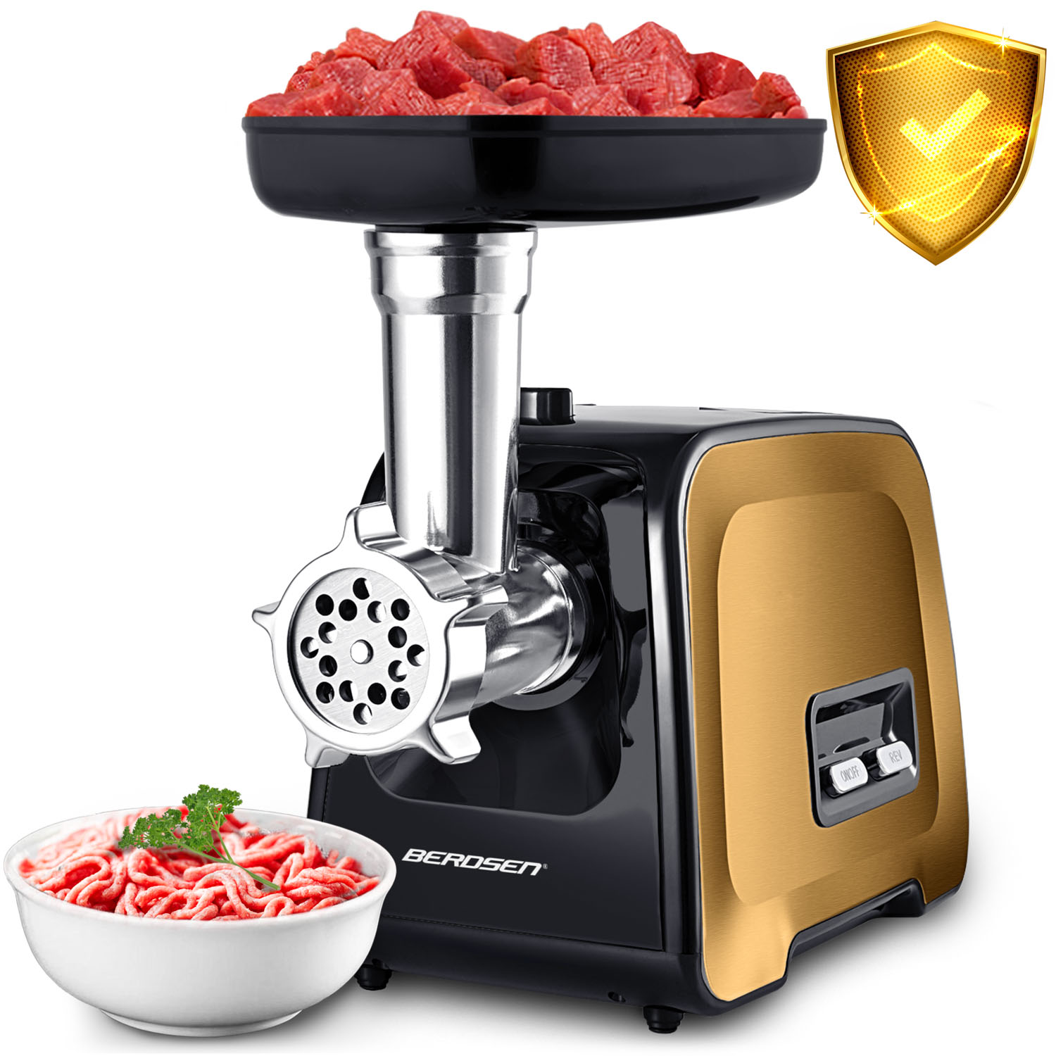 Maszynka do mięsa z surowym mięsem w tacy i mielonym mięsem w misce. Złota i czarna maszyna z tarczą bezpieczeństwa.