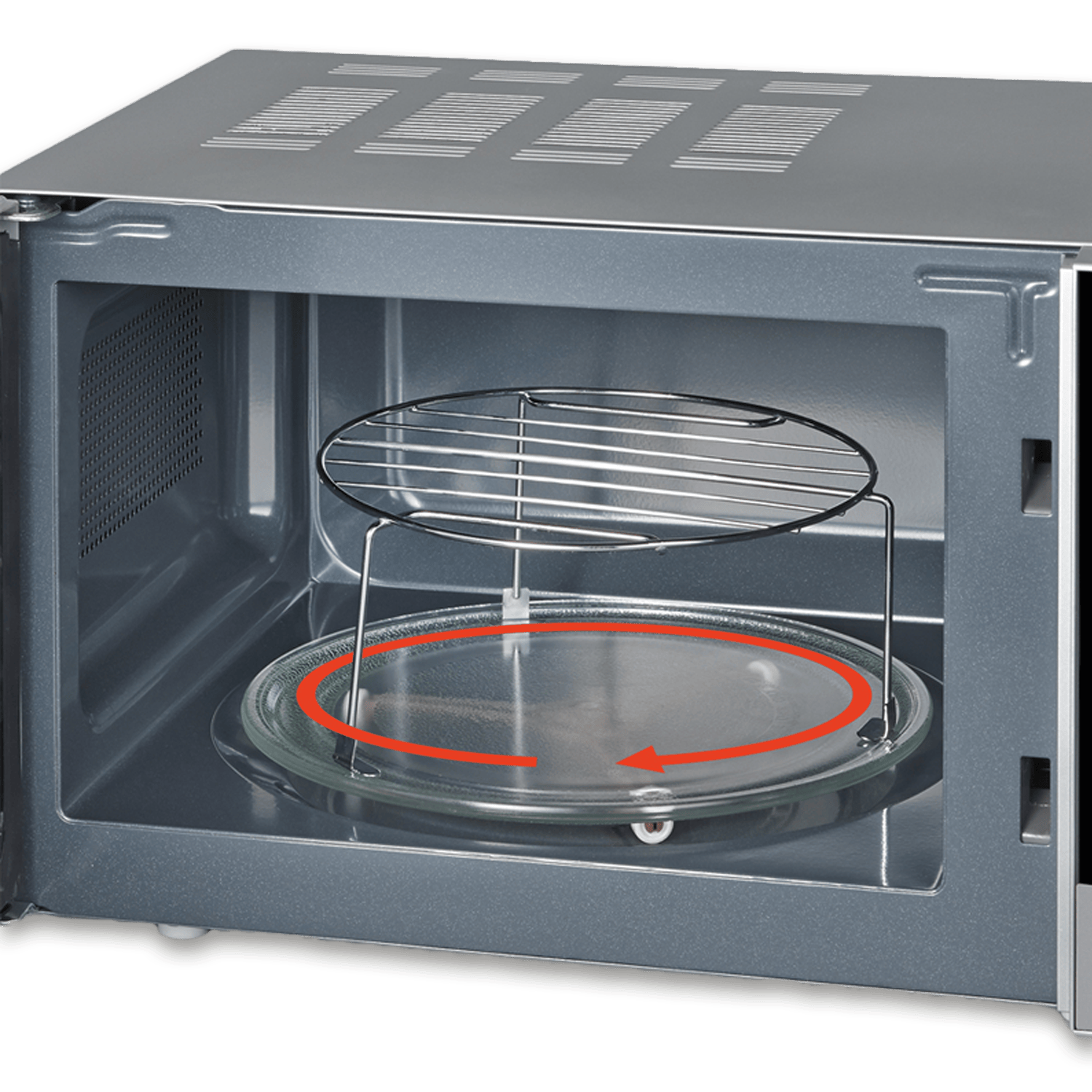 Wewnątrz kuchenki mikrofalowej: szklany talerz ze strzałką obrotu, metalowy ruszt i wnętrze. Rama ze stali nierdzewnej. Zielone tło.