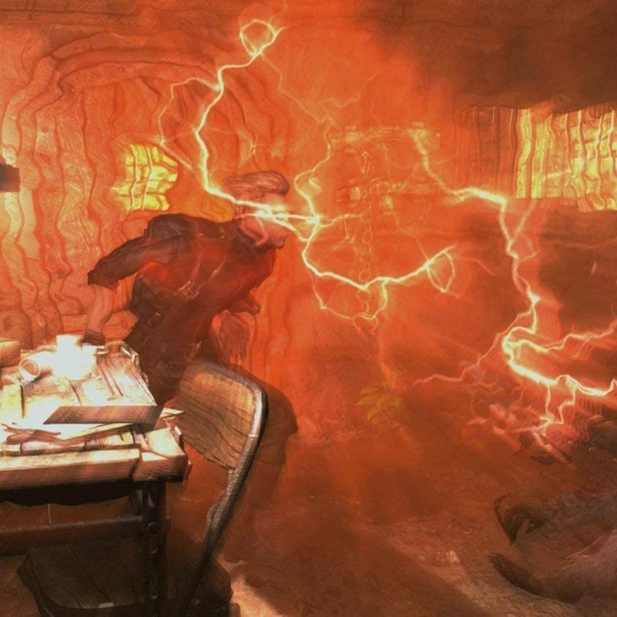 Mężczyzna w czerwono-pomarańczowym pokoju z błyskawicami. Jest obok biurka. Pokój ma strukturę podobną do jaskini.