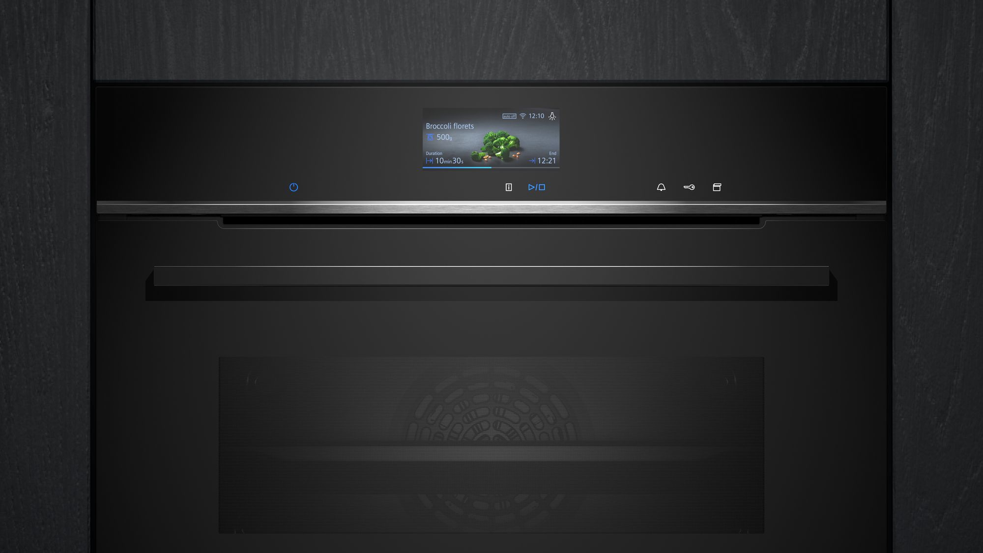 Een zwarte oven met een digitaal display met broccoliroosjes die gekookt worden. Het toont de tijd en de duur.