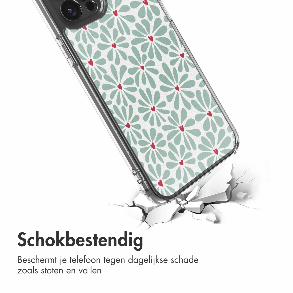Une coque de téléphone avec un motif floral brise une surface. La coque est transparente avec un motif de fleurs vertes et de coeurs rouges.