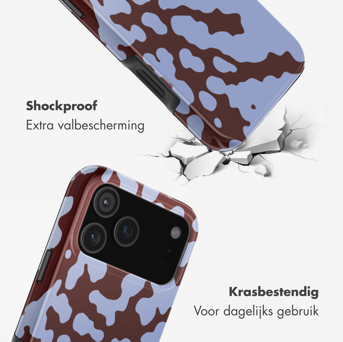 Twee telefoonhoesjes, één impacteert een oppervlak waardoor het barst. Hoesjes met een blauw en bruin koeienpatroon.