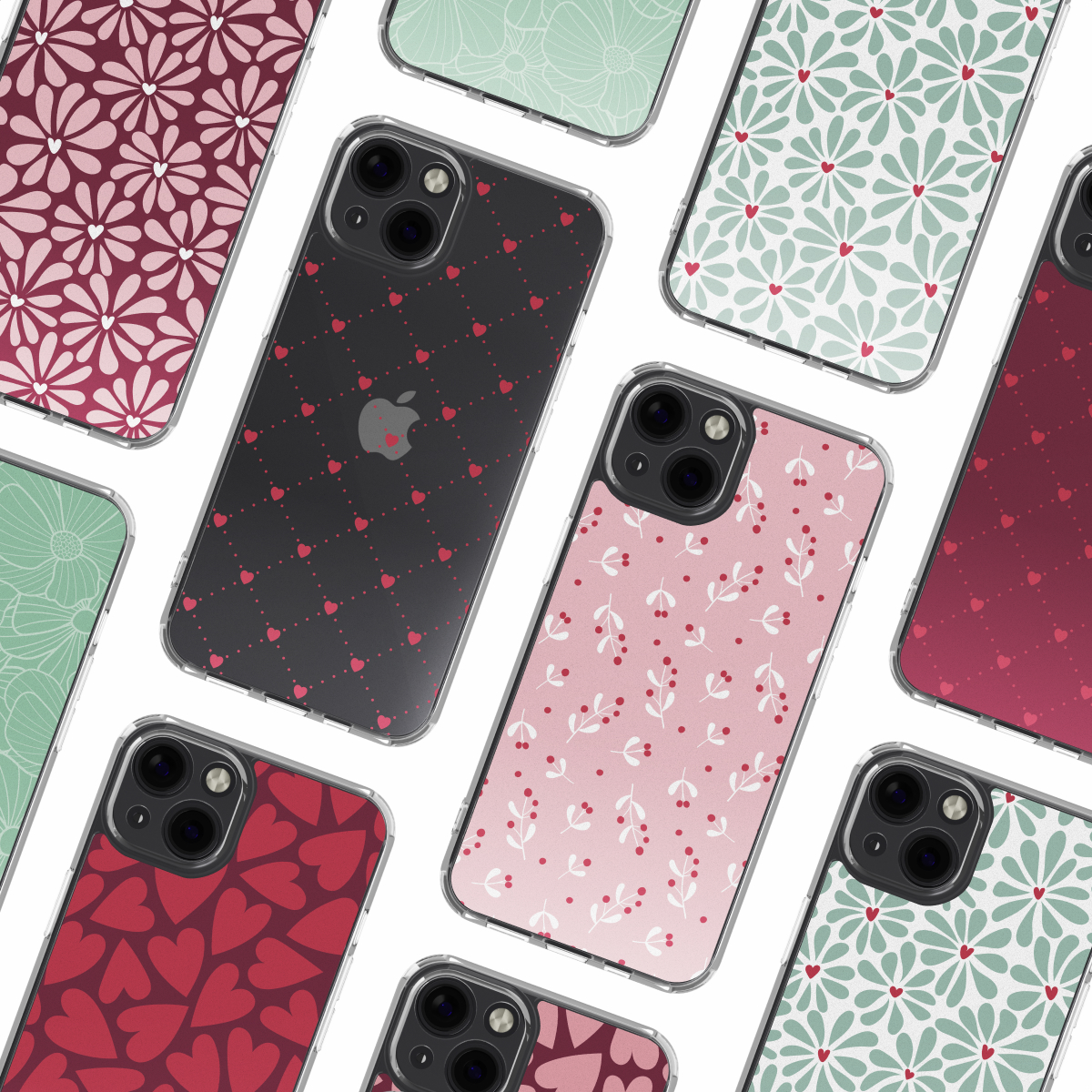 Verschillende iPhone-hoesjes met verschillende patronen. Sommige hebben bloemmotieven, harten of stippen. De hoesjes liggen op een witte ondergrond.