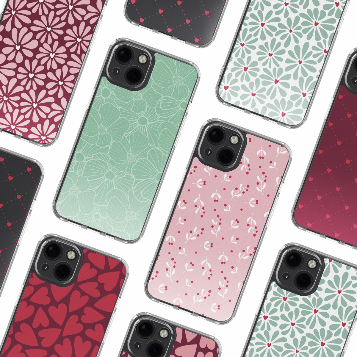 Plusieurs coques d'iPhone avec divers motifs floraux et en forme de cœur. Les coques sont dans les tons de rouge, rose et vert sur fond blanc.