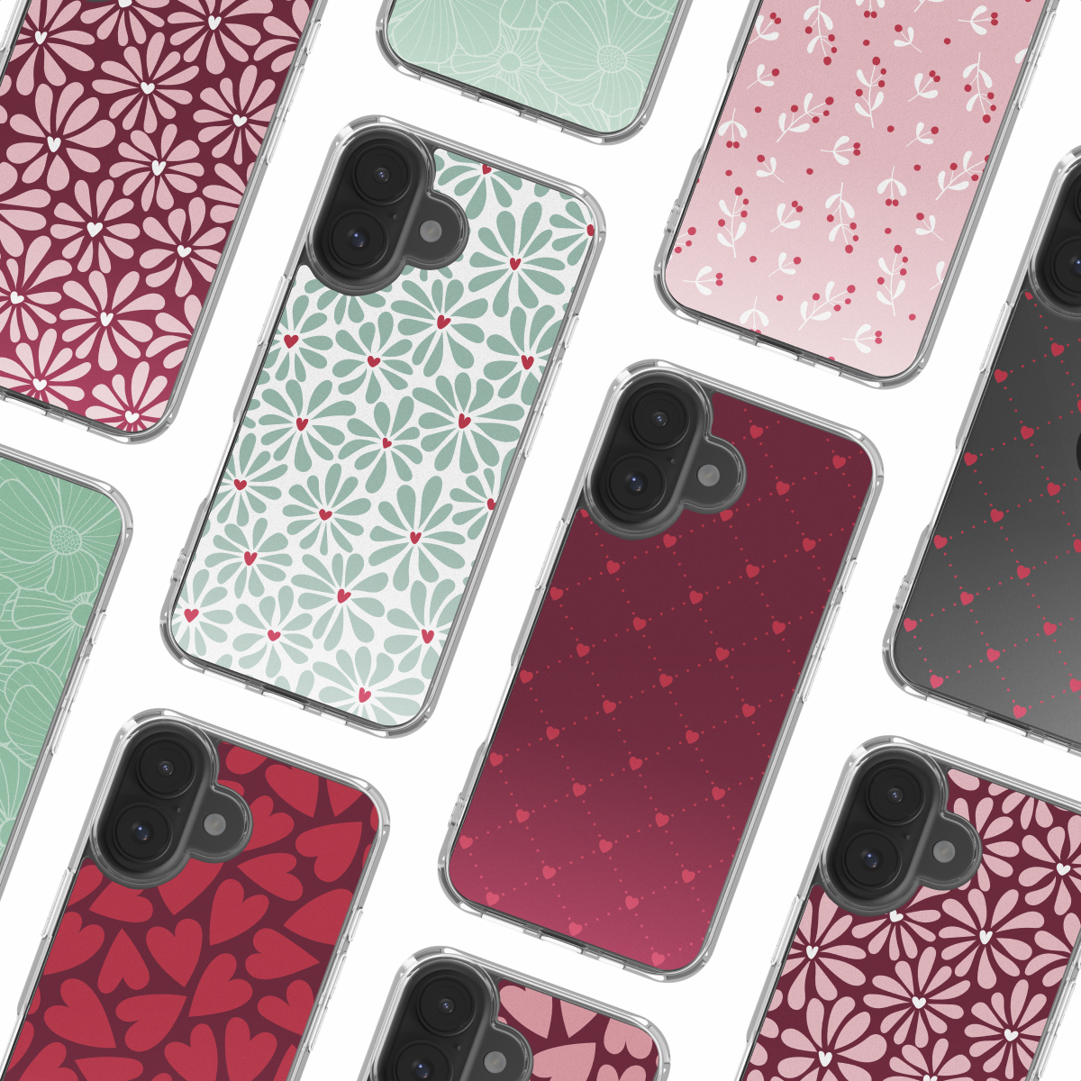 Plusieurs coques de téléphone avec divers motifs floraux et en forme de cœur, dans des tons de rouge, rose et vert. Les coques sont disposées sur fond blanc.