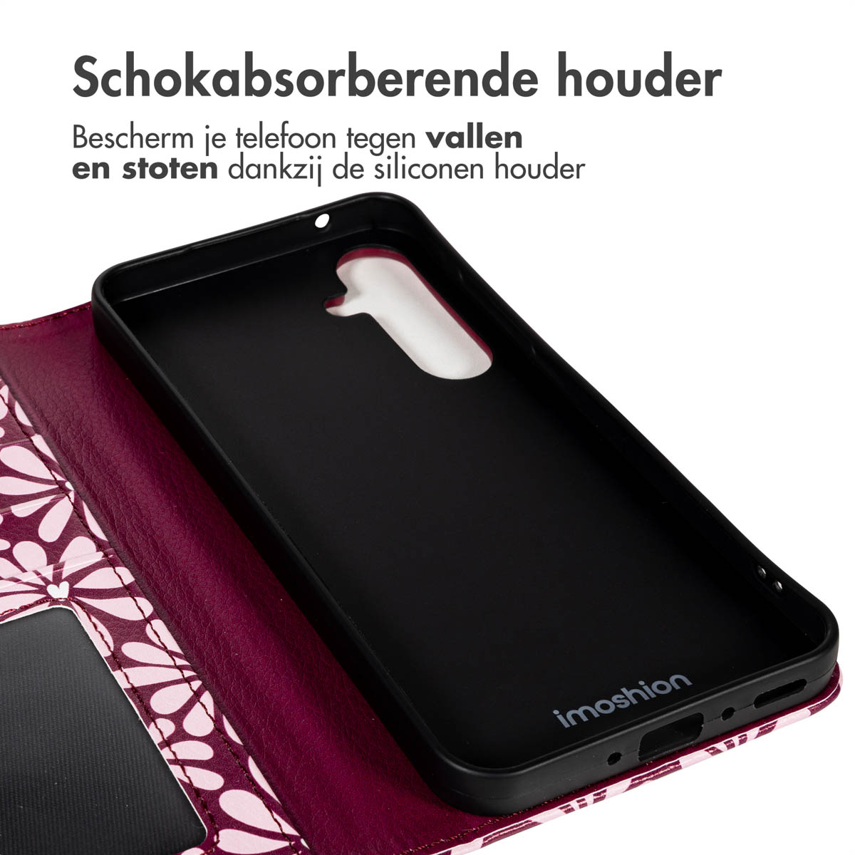 Un étui de téléphone noir avec la marque 'imoshion' est posé sur un portefeuille violet à motifs. Le texte ci-dessus indique 'support absorbant les chocs'.