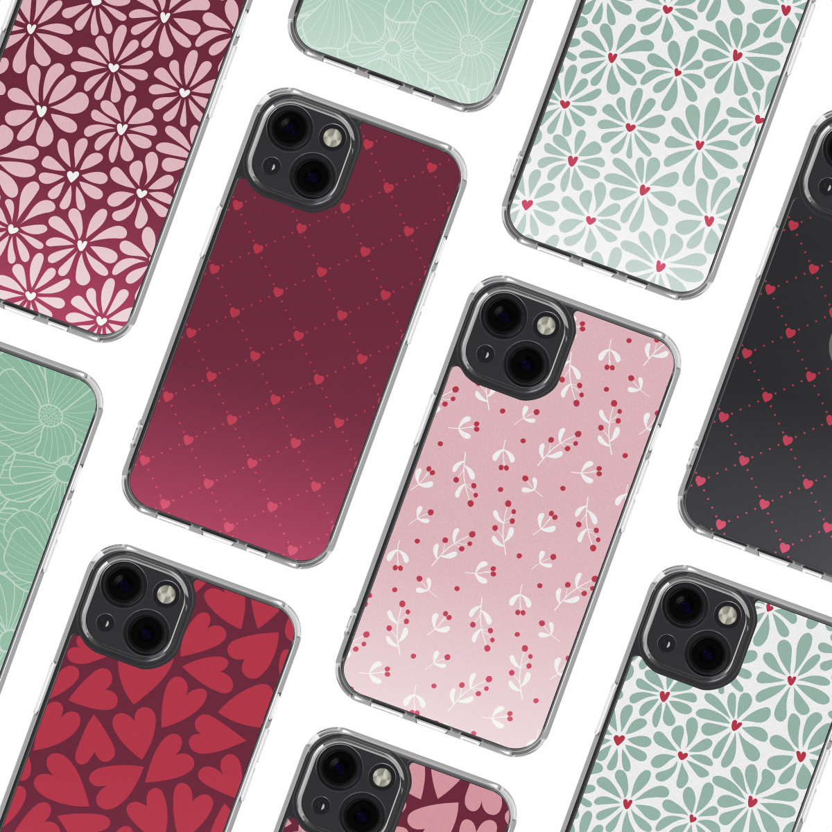 Plusieurs coques de téléphone avec divers motifs : floraux, cœurs et feuilles en rouge, rose et vert. Coques sur fond blanc.