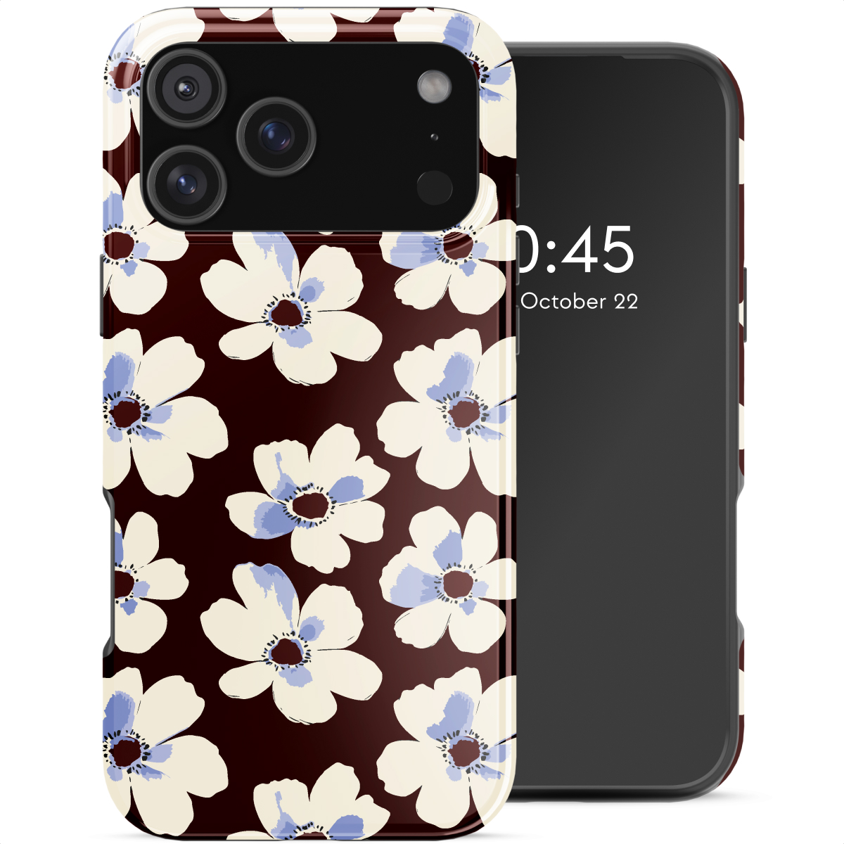 Een telefoonhoesje met witte bloemen met blauwe centra op een donkerbruine achtergrond. Ernaast een telefoon met een zwart scherm.