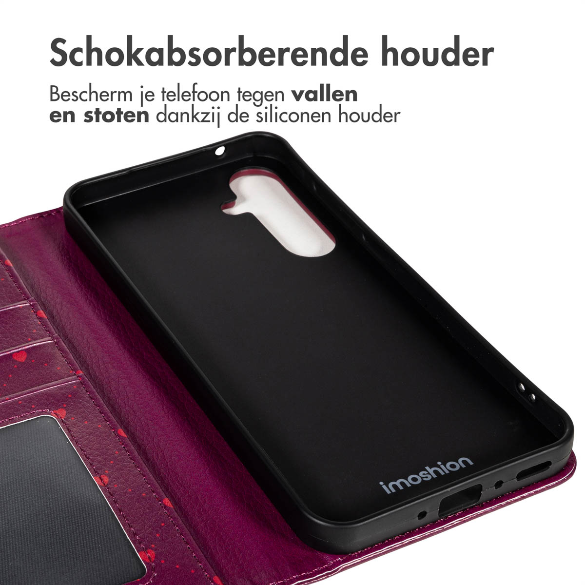 Een zwarte telefoonhoes met een paarse portemonnee. De hoes is open en toont de binnenkant. De tekst bovenaan luidt 'Schokabsorberende houder'.
