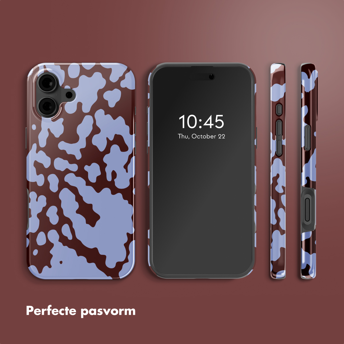 Tre telefoni con custodie a stampa di mucca e un telefono nero al centro. L'ora sullo schermo è 10:45, giovedì 22 ottobre.