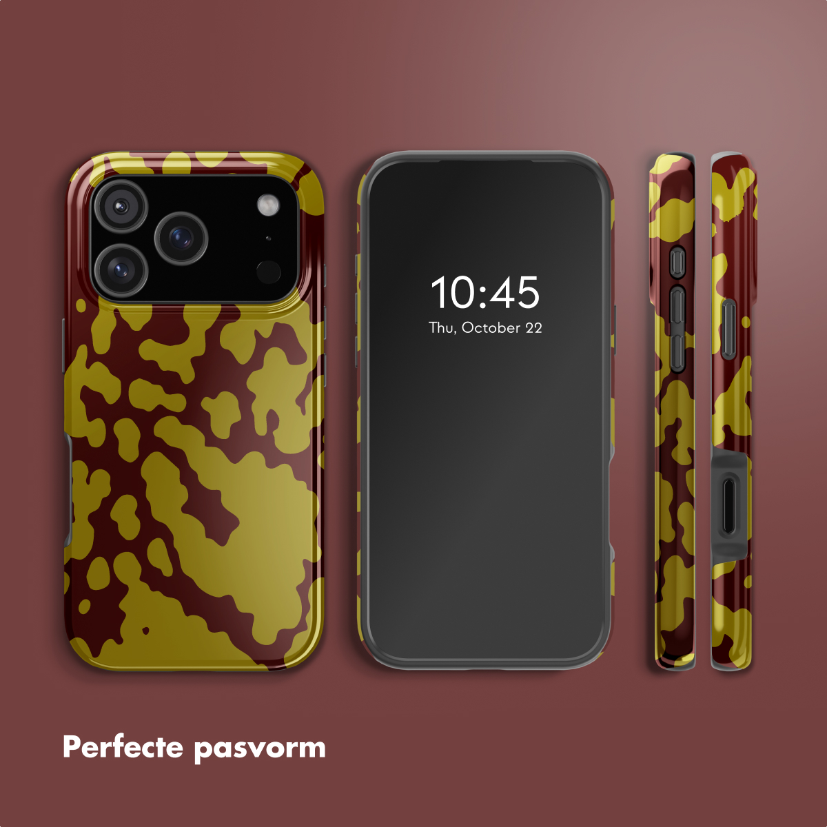 Telefoon met camouflagehoes. De tijd is 10:45 uur, donderdag 22 oktober. Hoes heeft bruin en geel patroon. Donkerrode achtergrond.