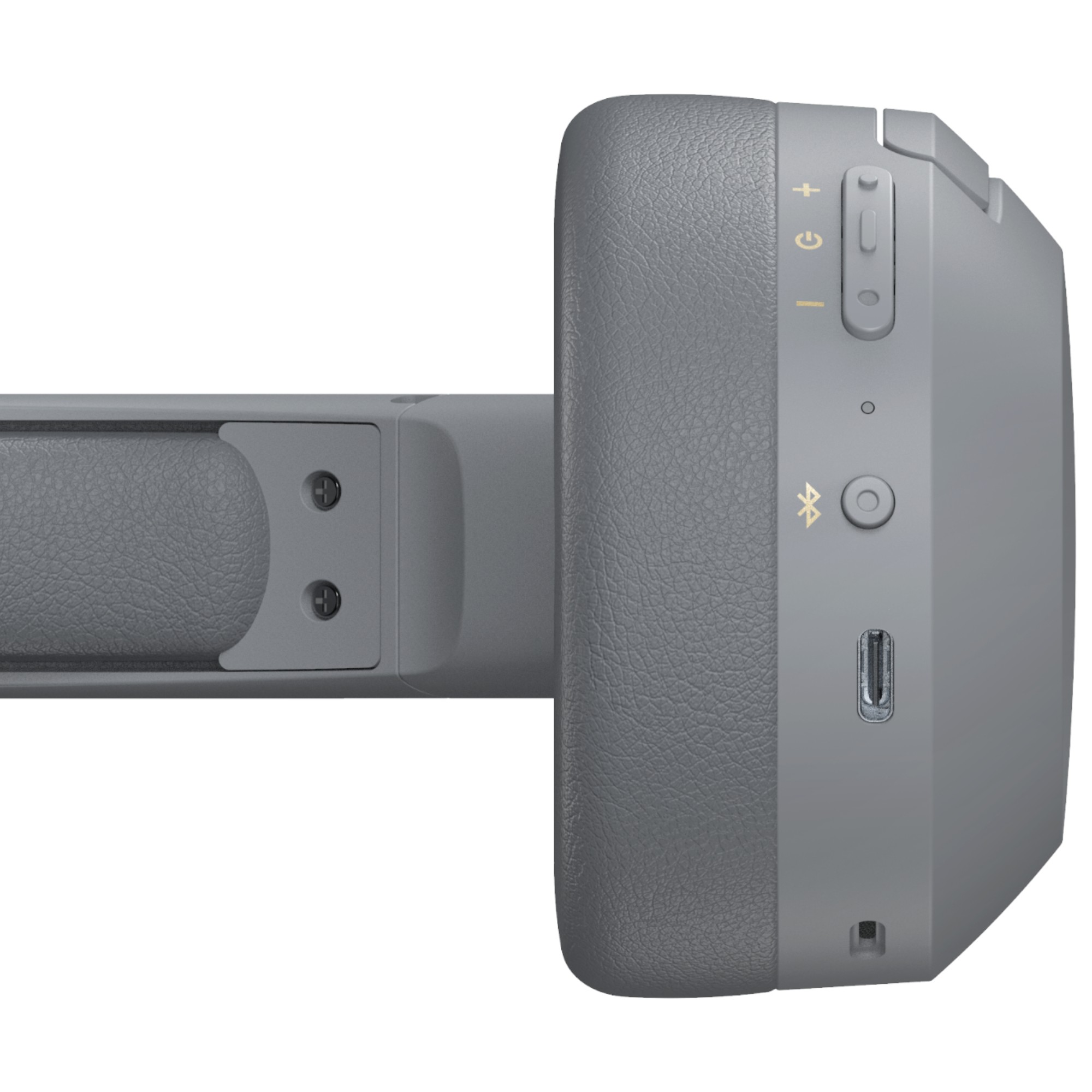 Zbliżenie szarego słuchawek. Przyciski, port USB i symbol Bluetooth są widoczne z boku.