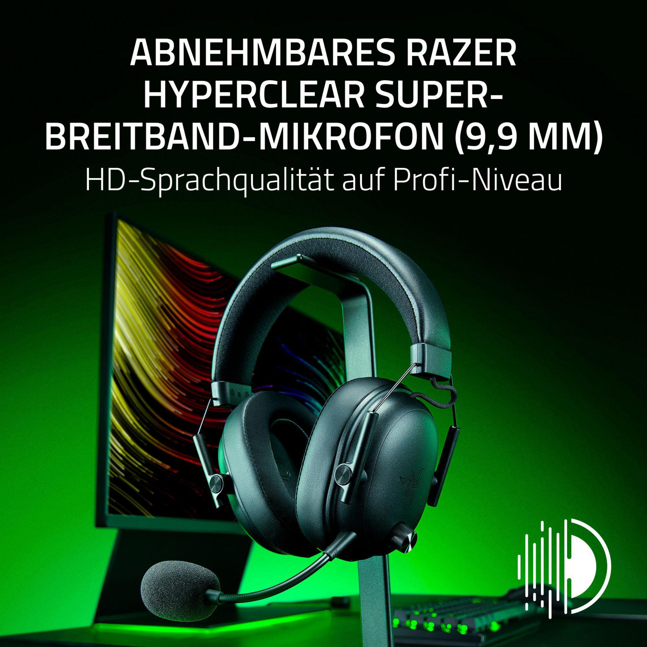 Czarne słuchawki Razer z mikrofonem na stojaku, zielone tło i tekst o produkcie.