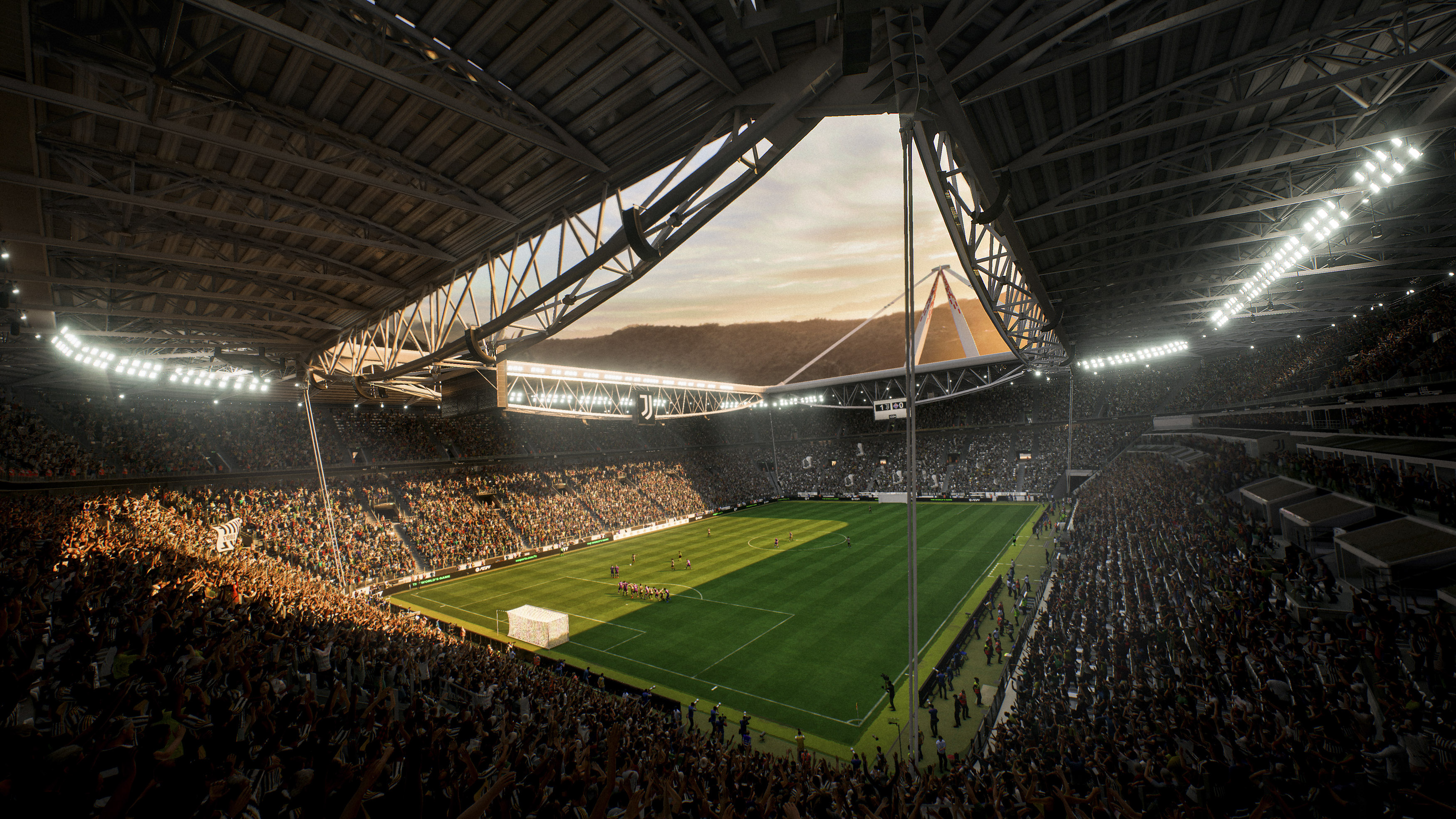 Panoramablick auf ein Stadion mit grünem Feld, gefüllten Tribünen und einem teilweise offenen Dach mit Himmel.