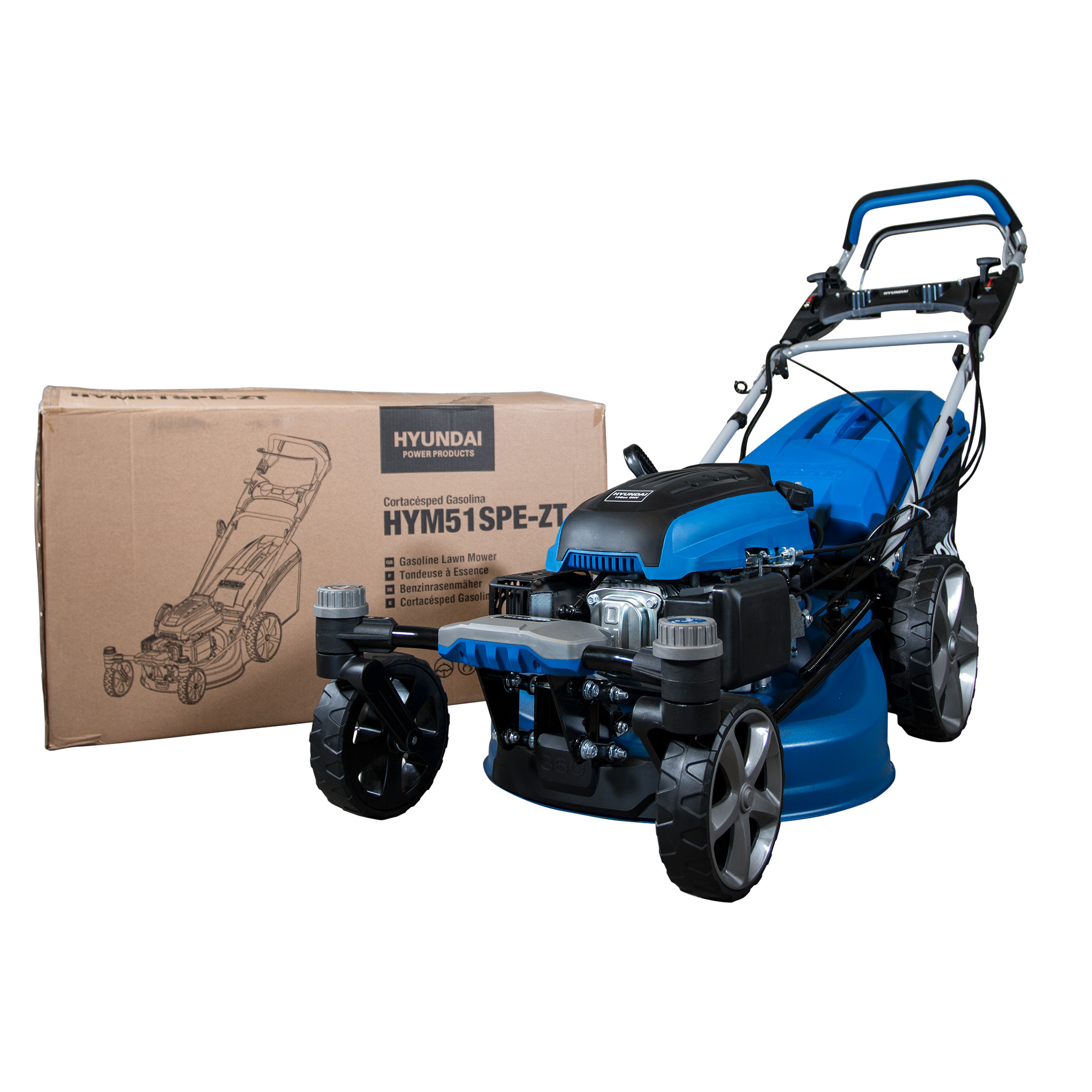 Un cortacésped Hyundai azul y negro junto a su caja de cartón, sobre un fondo blanco. La caja tiene un dibujo del cortacésped.