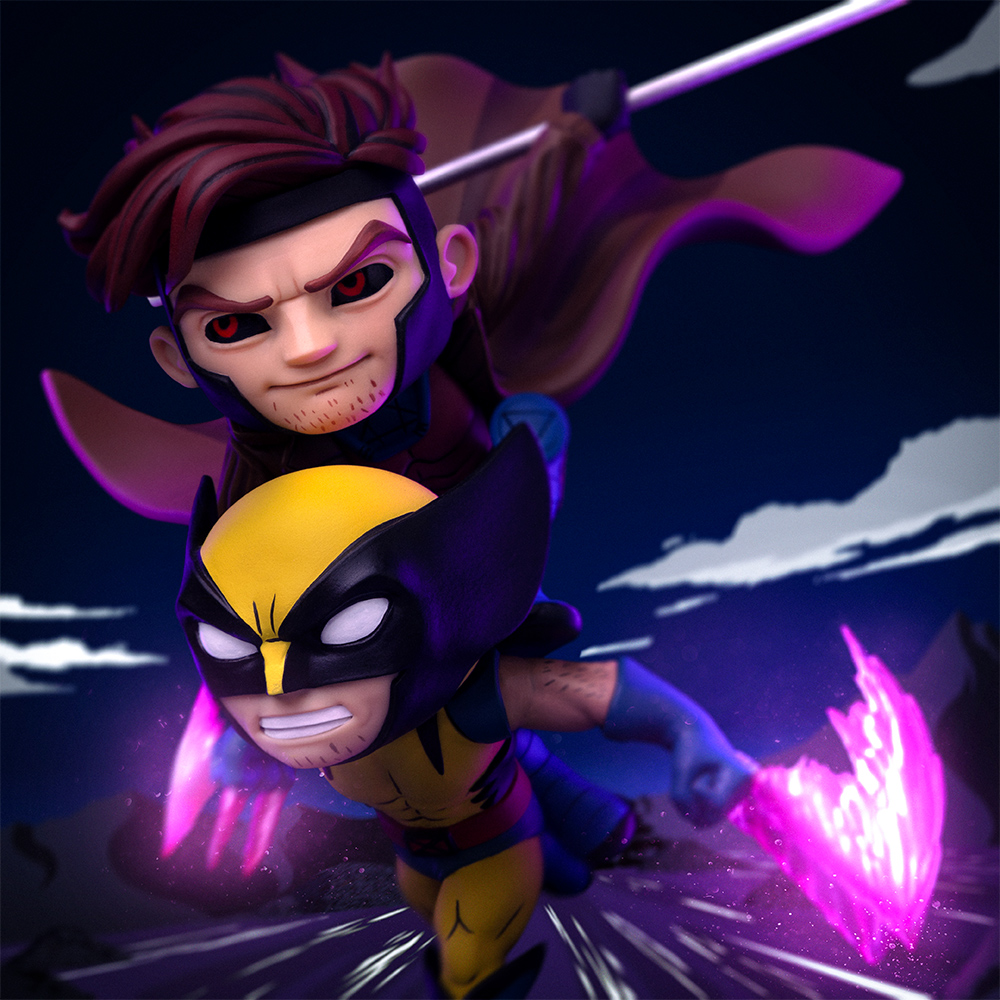 Statue di Wolverine e Gambit in azione. Wolverine con artigli, Gambit con bastone. Entrambe le statue sono in pose dinamiche su sfondo scuro.