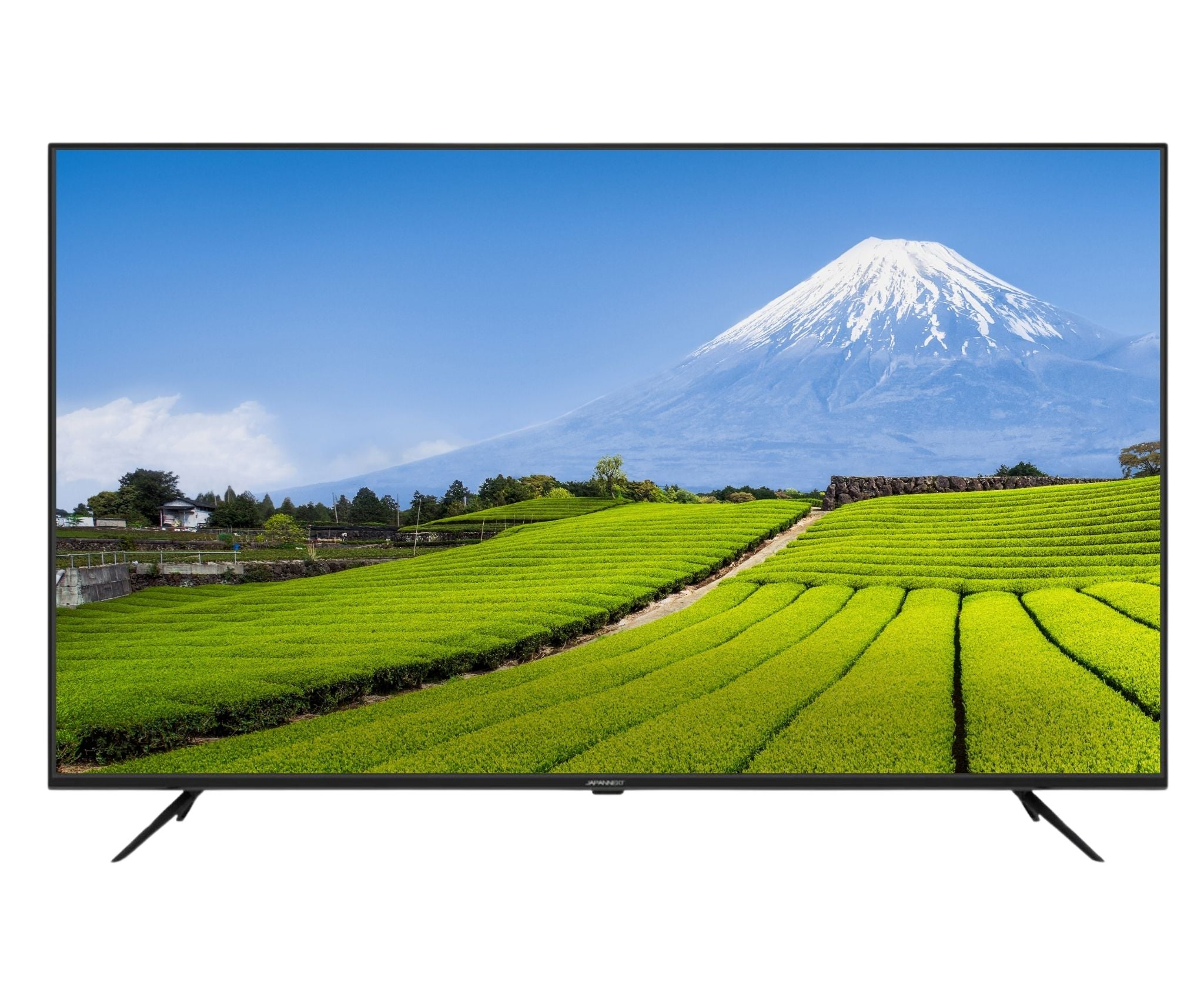 Der Fernseher zeigt den Berg Fuji über grünen Teeplantagen unter blauem Himmel. Weißer Schnee bedeckt den Gipfel.