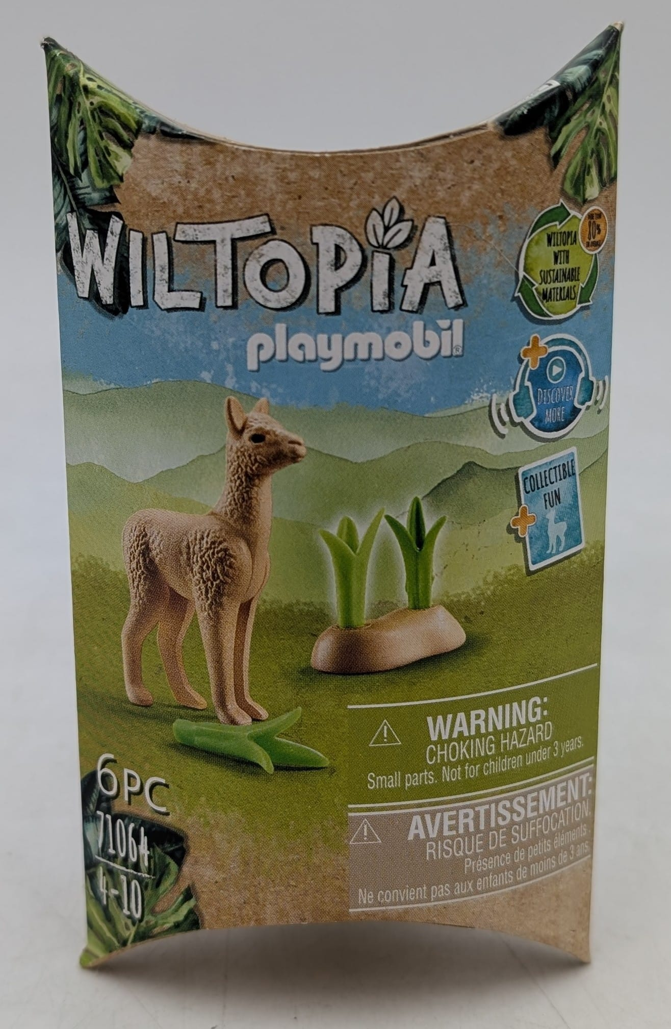Pudełko Playmobil przedstawia figurkę lamy z trawą. Pudełko mówi 'Wiltopia'.