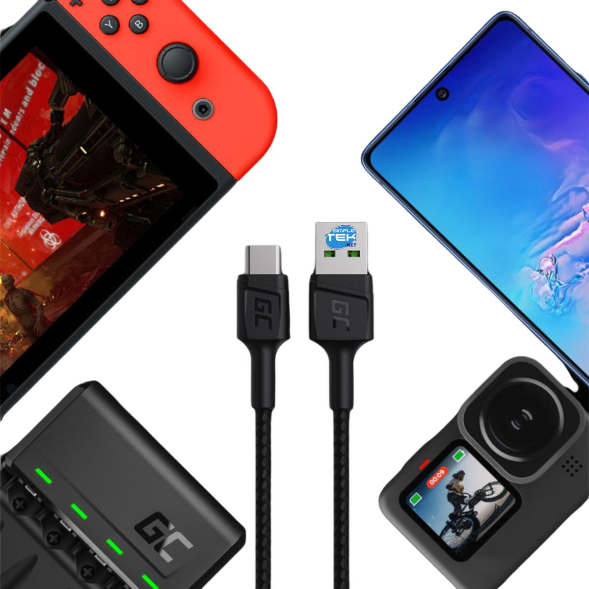 Una console di gioco rossa, un telefono, una fotocamera, un caricatore e cavi USB sono disposti su una superficie bianca.