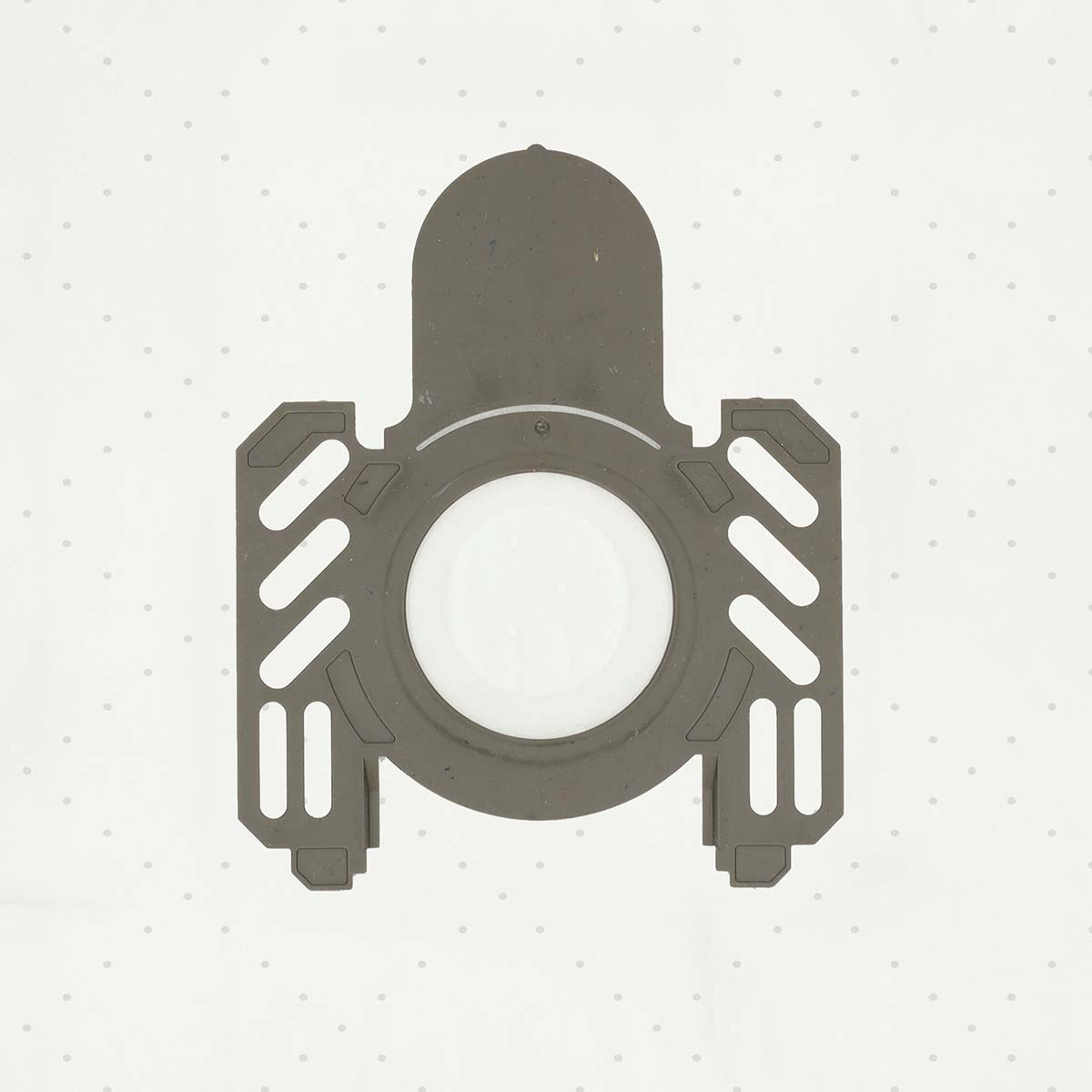 A gray, plastic vacuum filter with a large central hole and rectangular side sections with diagonal slits, on a dotted white background.