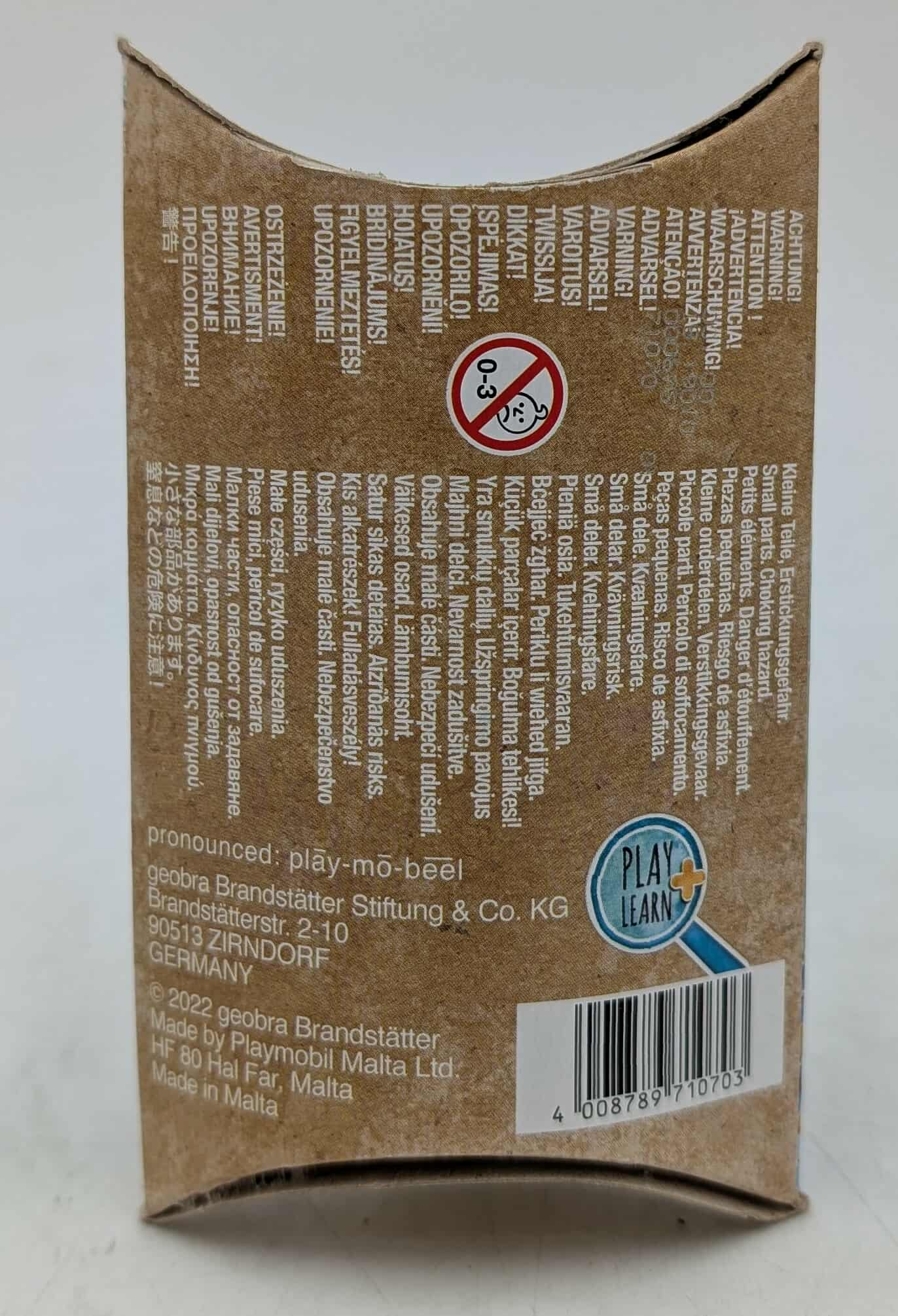 Box with warnings in multiple languages, including small parts hazard and choking warnings. Brand logo and barcode.
