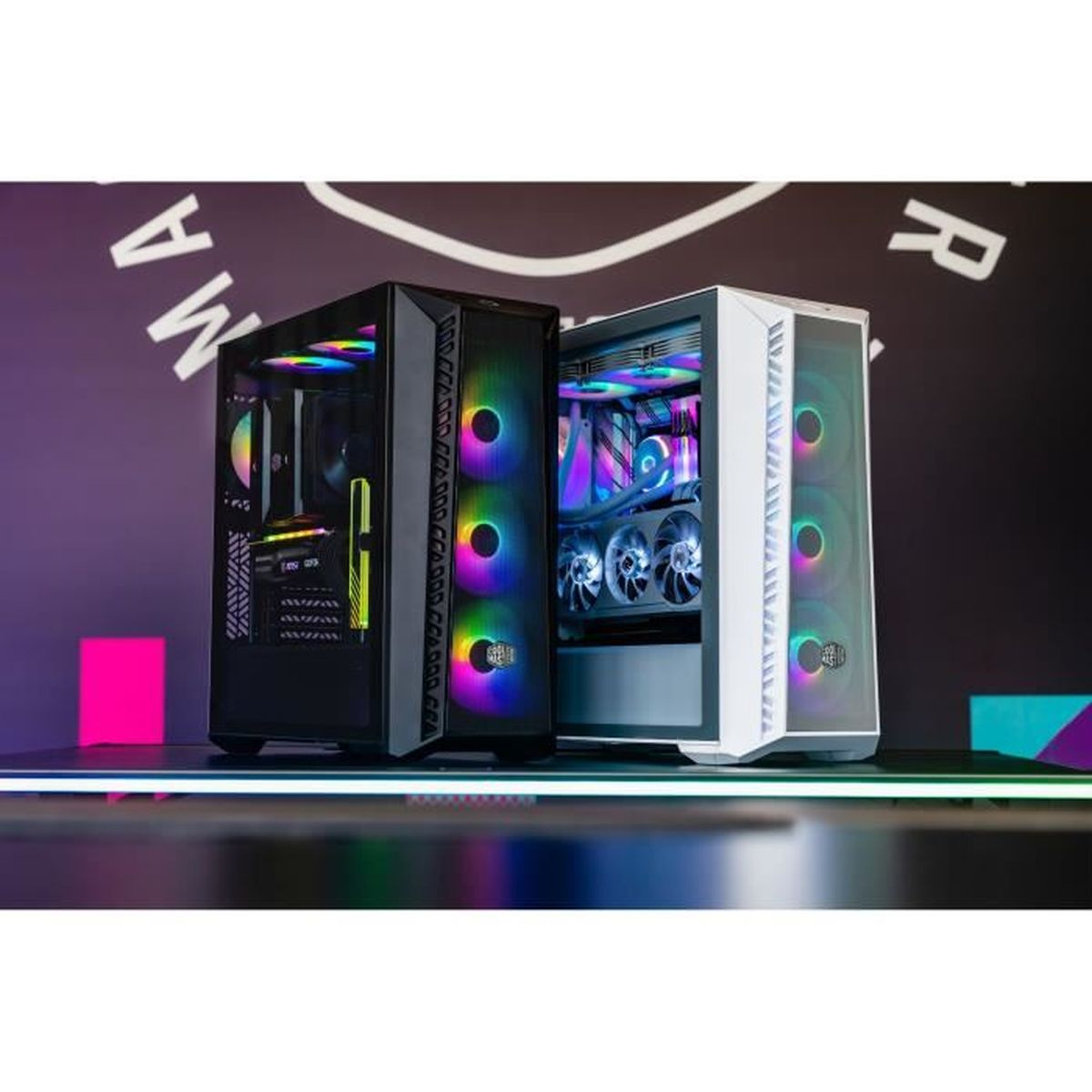 Two computer cases, one black and one white, with colorful LED fans. Background features a logo and a neon-lit table.