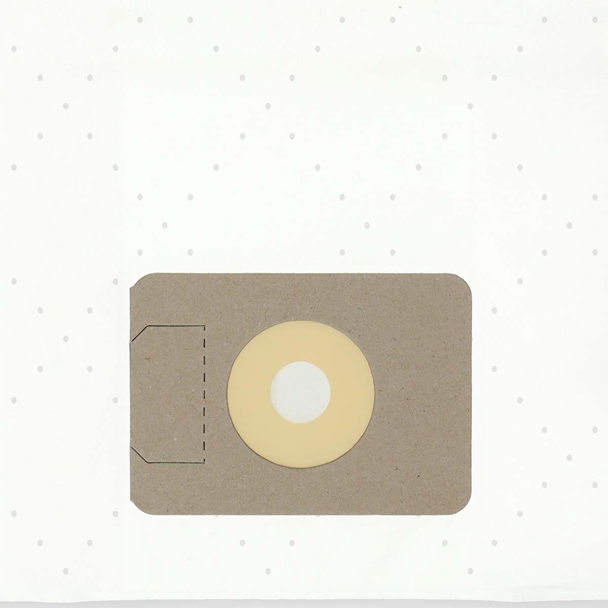 A beige vacuum cleaner bag with a yellow circle and white center. The background has white paper with small gray dots.