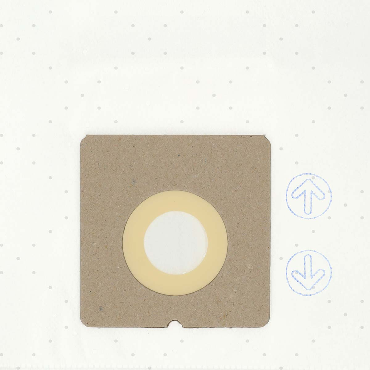 A square cardboard object with a central beige circle and white center. Arrows are above and below. Background is white with grey dots.